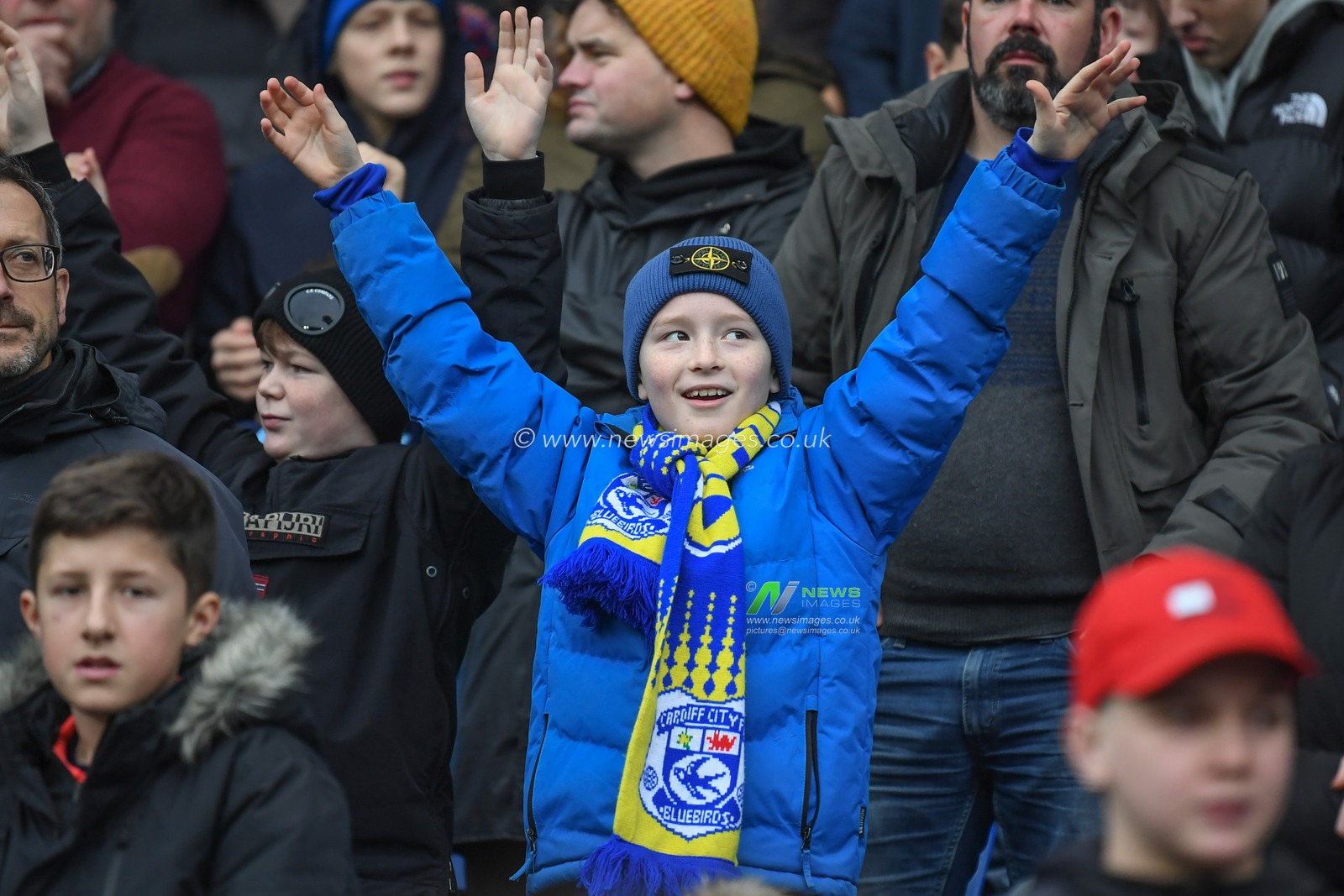 A young Cardiff City fan chants during the Emirates FA Cup Third Round match Cardiff City vs Leeds United at Cardiff City Stadium, Cardiff, United Kingdom, 8th January 2023

(Photo by Mike Jones/News Images)