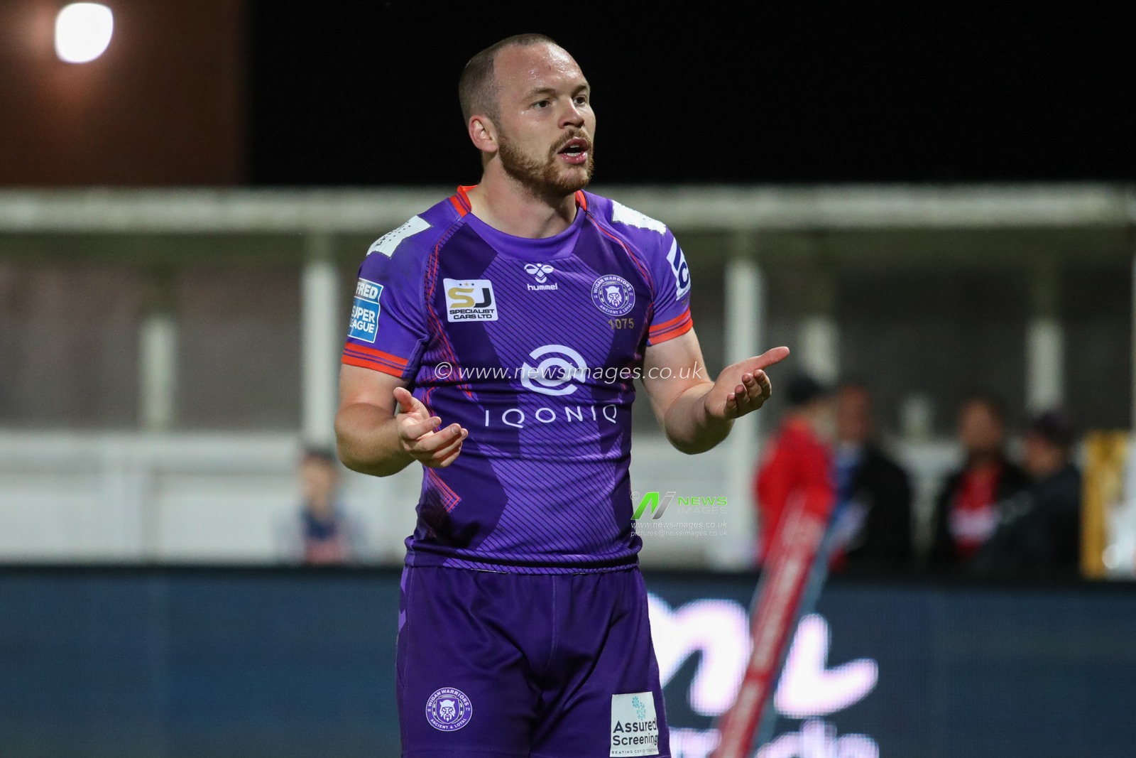 Liam Marshall (5) of Wigan Warriors questions referee Liam Mooreâ€™s decision