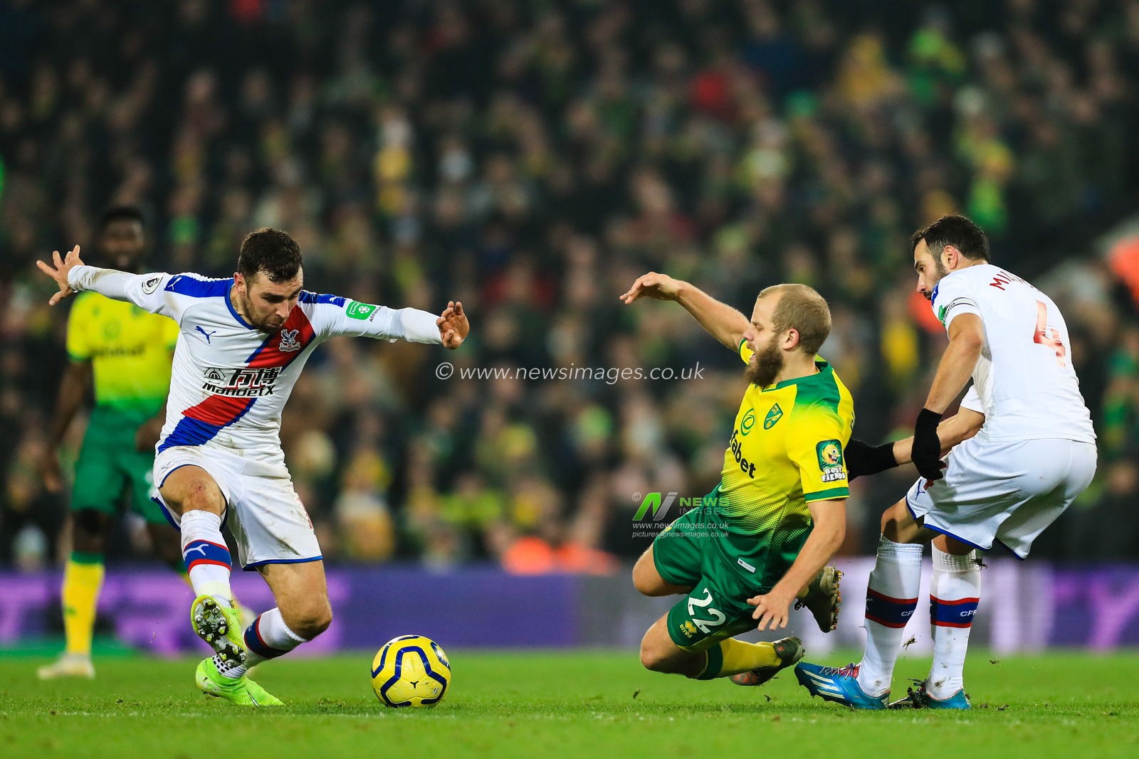 1st January 2020, Carrow Road, Norwich, England; Premier League, Norwich City v Crystal Palace : Teemu Pukki (22) of Norwich City appears to be fouled by Luka Milivojevic (4) of Crystal Palace 

Credit: Georgie Kerr/News Images