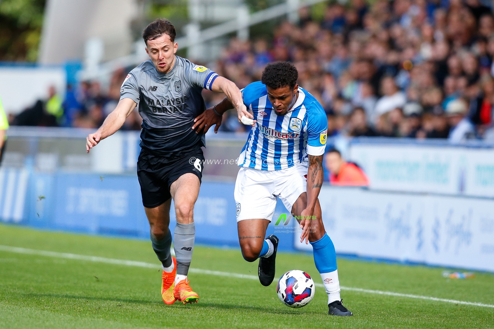 Tino Anjorin #8 of Huddersfield Town and Ryan Wintle #6 of Cardiff City during the Sky Bet Championship match Huddersfield Town vs Cardiff City at John Smith's Stadium, Huddersfield, United Kingdom, 17th September 2022

(Photo by Ben Early/News Images)