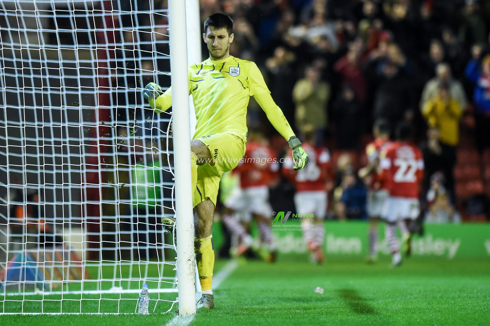 11th January 2020, Oakwell, Barnsley, England; Sky Bet Championship, Barnsley v Huddersfield Town : Kamil Grabara (1) of Huddersfield Town kicks the post after Conor Chaplin (11) of Barnsley FC makes it 2-0 to Barnsley FC.

Credit: Dean Williams/News Images