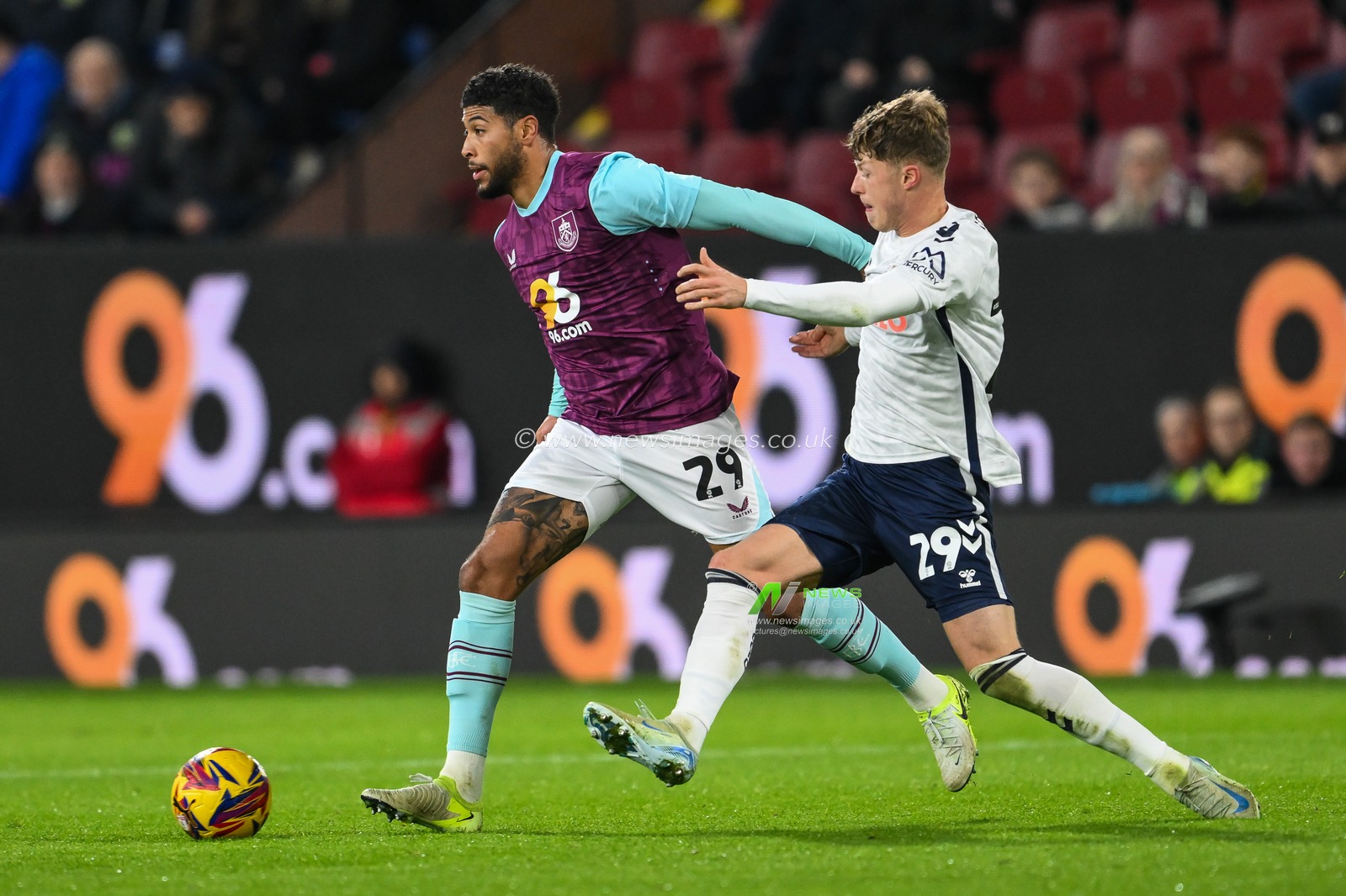 Josh Laurent of Burnley holds off Victor Torp of Coventry City during the Sky Bet Championship match Burnley vs Coventry City at Turf Moor, Burnley, United Kingdom, 26th November 2024

(Photo by Craig Thomas/News Images)