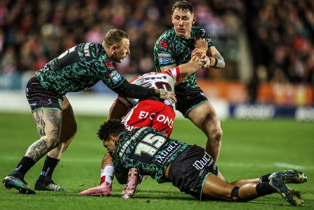 Lewis Murphy of St Helens is tackled by Josh Charnley of Leigh Leopards and Jacob Alick-Wiencke of Leigh Leopards during the Betfred Super League match St Helens vs Leigh Leopards at The BrewDog Stadium, St Helens, United Kingdom on 20 February 2026

(Photo by Alfie Cosgrove/News Images)