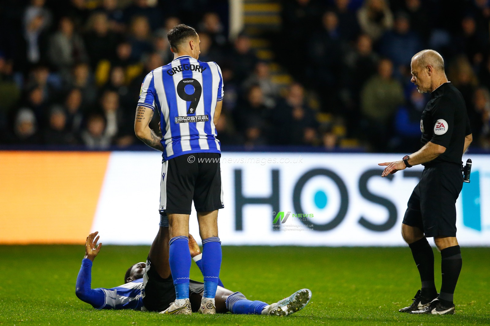 Lee Gregory #9 of Sheffield Wednesday helps Dominic Iorfa #6 of Sheffield Wednesday with cramp during the Sky Bet League 1 match Sheffield Wednesday vs Shrewsbury Town at Hillsborough, Sheffield, United Kingdom, 19th November 2022

(Photo by Ben Early/News Images)