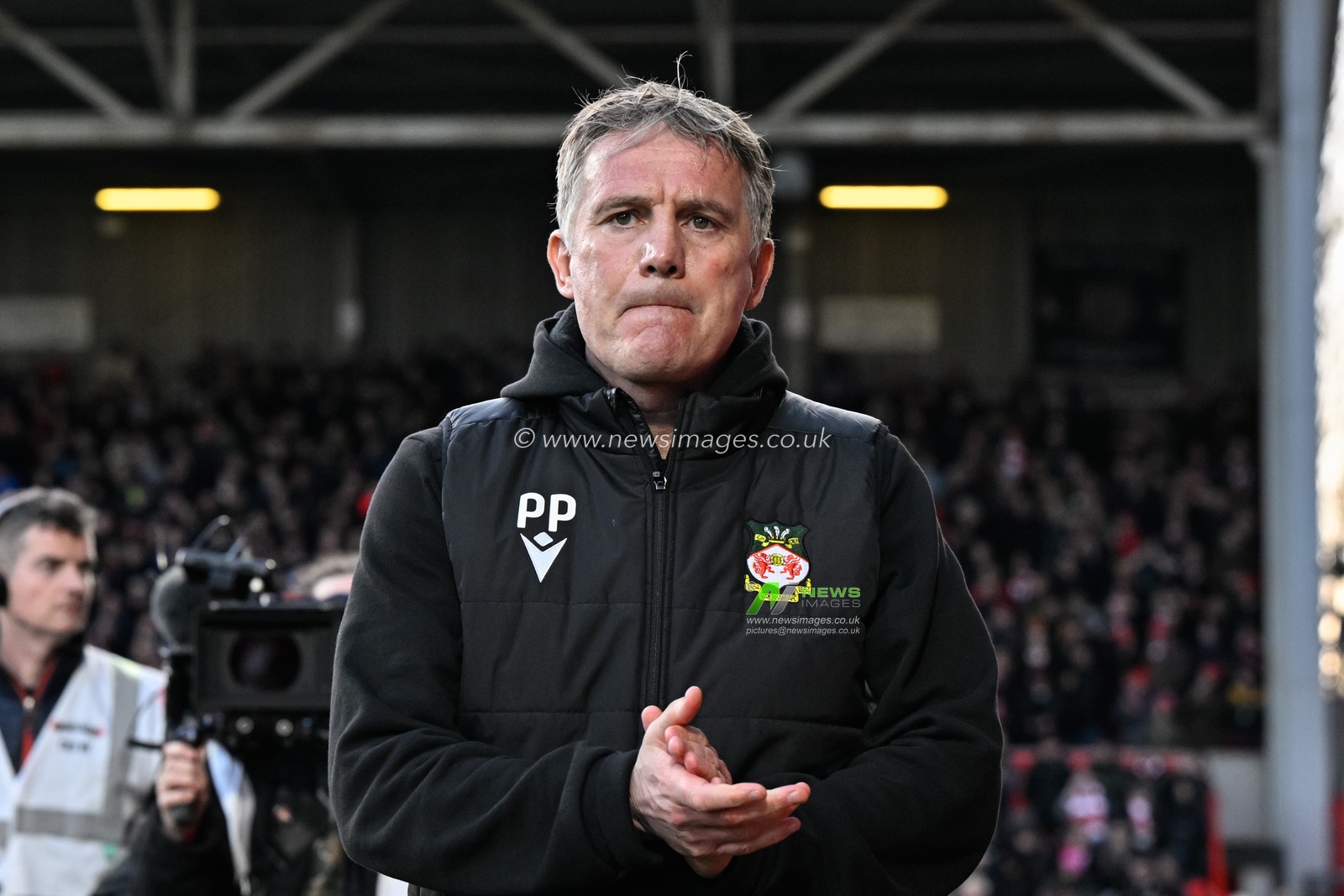 Phil Parkinson manager of Wrexham walks towards the bench ahead of kick off, during the Sky Bet League 2 match Wrexham vs Crawley Town at SToK Cae Ras, Wrexham, United Kingdom, 9th April 2024

(Photo by Cody Froggatt/News Images)