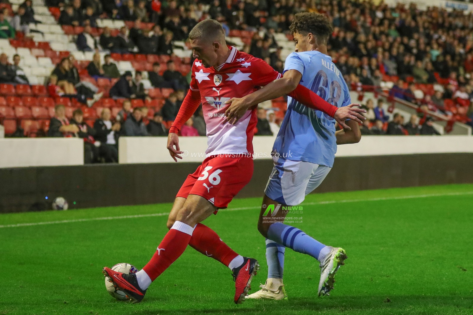 Max Watters #36 of Barnsley breaks with the ball as Max Alleyne #68 of Manchester City U21 pressures during the EFL Trophy match Barnsley vs Manchester City U21 at Oakwell, Barnsley, United Kingdom, 26th September 2023

(Photo by Alfie Cosgrove/News Images)