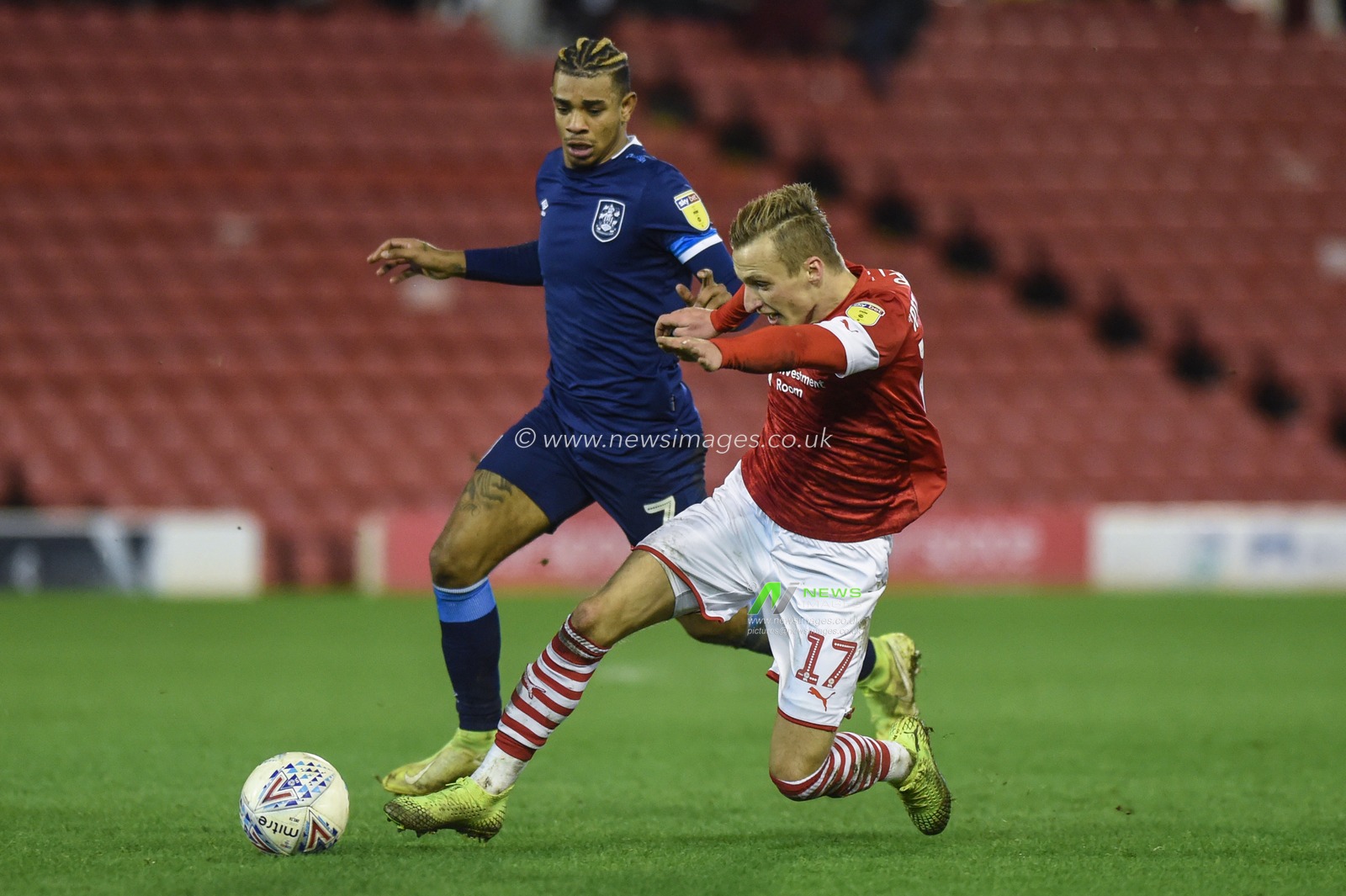 11th January 2020, Oakwell, Barnsley, England; Sky Bet Championship, Barnsley v Huddersfield Town : Marcel Ritzmaier (17) of Barnsley FC takes on Juninho Bacuna (7) of Huddersfield Town 

Credit: Dean Williams/News Images