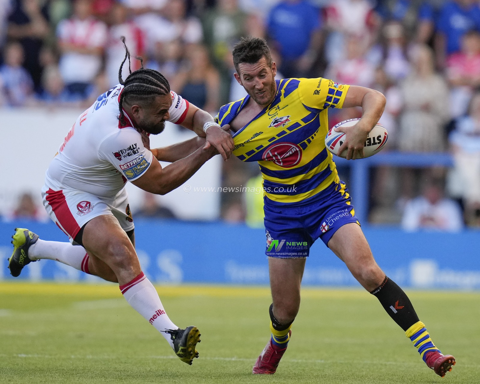 Konrad Hurrell #23 of St Helens grips onto Stefan Ratchford #4 of Warrington Wolves during the Betfred Super League Round 18 match Warrington Wolves vs St Helens at Halliwell Jones Stadium, Warrington, United Kingdom, 7th July 2023

(Photo by Steve Flynn/News Images)