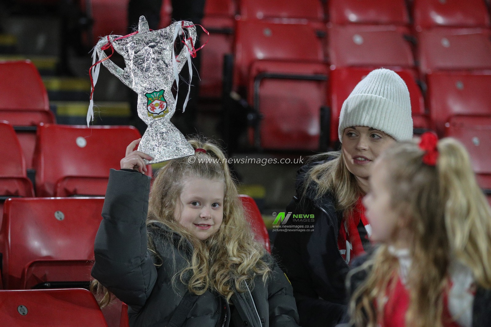 A young fan shows off her tinfoil FA Cup ahead of the Emirates FA Cup Fourth Round Replay match Sheffield United vs Wrexham at Bramall Lane, Sheffield, United Kingdom, 7th February 2023

(Photo by James Heaton/News Images)