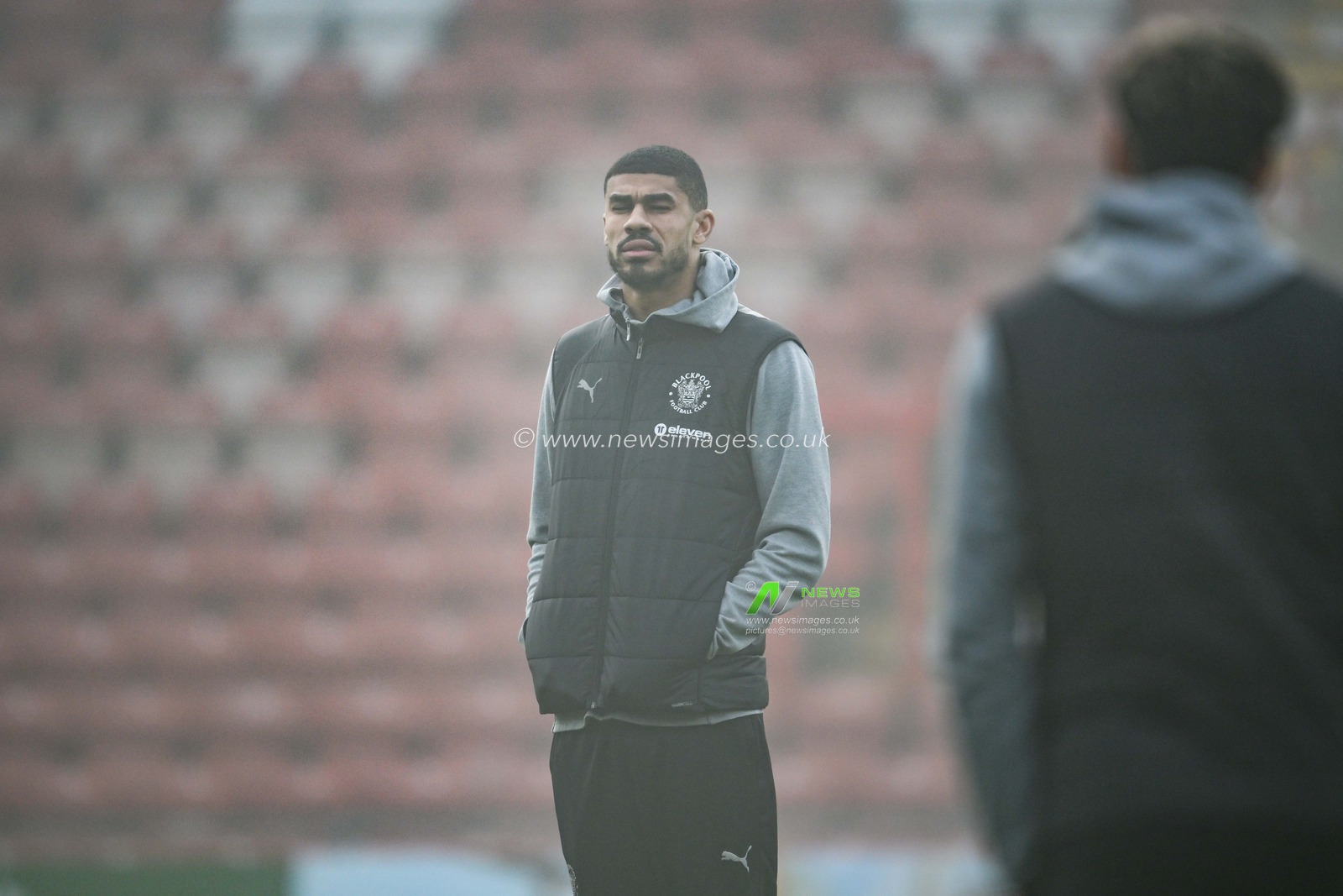 Ashley Fletcher of Blackpool stand on the foggy pitch as he arrives ahead of the Sky Bet League 1 match Wrexham vs Blackpool at SToK Cae Ras, Wrexham, United Kingdom, 26th December 2024

(Photo by Craig Thomas/News Images)