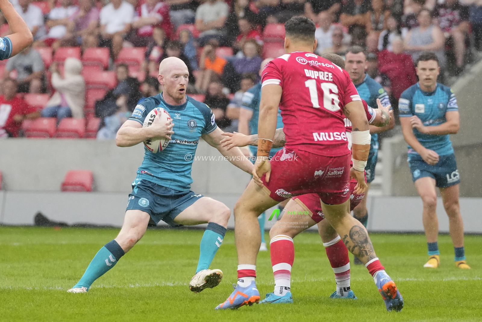 Liam Farrell #12 of Wigan Warriors runs at Salford Red Devils defence during the Betfred Super League Round 16 match Salford Red Devils vs Wigan Warriors at AJ Bell Stadium, Eccles, United Kingdom, 25th June 2023

(Photo by Steve Flynn/News Images)