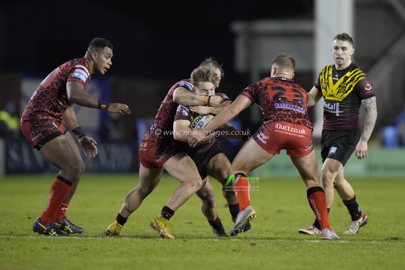 Leon Hayes of Warrington Wolves is tackled high during the Rugby League Joe Philbin Testimonial match Warrington Wolves vs Leigh Leopards at Halliwell Jones Stadium, Warrington, United Kingdom, 3rd February 2024

(Photo by Steve Flynn/News Images)