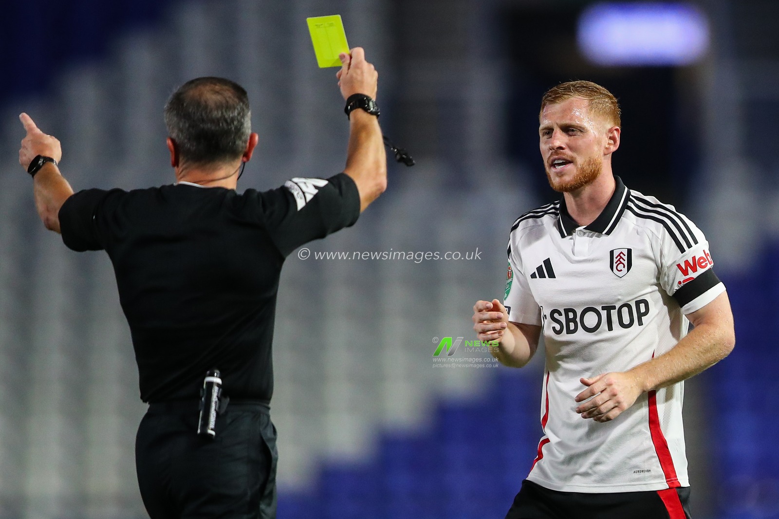 Harrison Reed of Fulham is shown a yellow card by referee Keith Stroud during the Carabao Cup match Birmingham City vs Fulham at St Andrews, Birmingham, United Kingdom, 27th August 2024

(Photo by Gareth Evans/News Images)