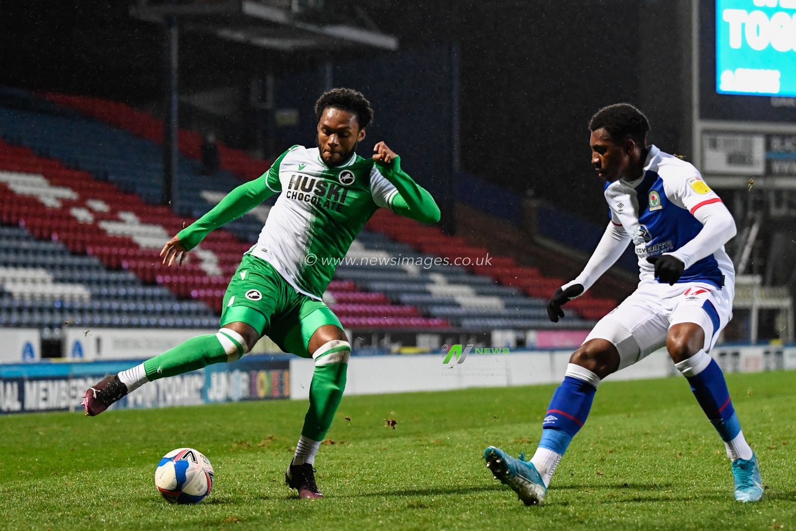 Mahlon Romeo #12 of Millwall looks to get past Amariâ€™i Bell #17 of Blackburn Rovers