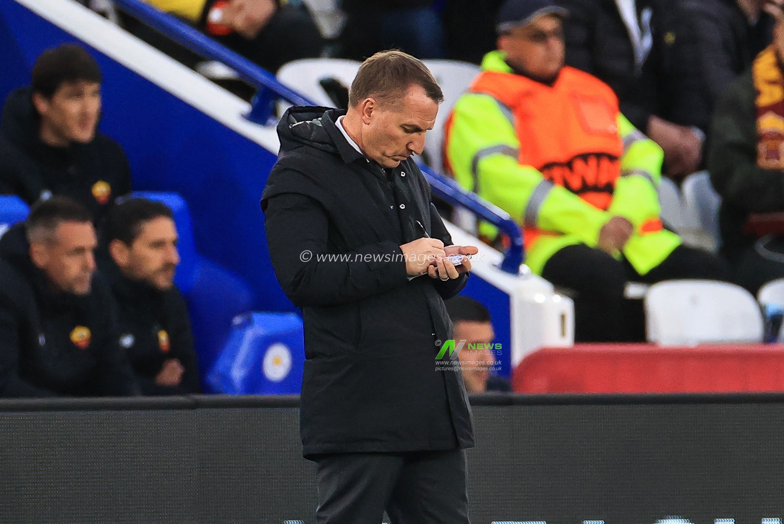 Brendan Rogers manager of Leicester City makes notes during the game