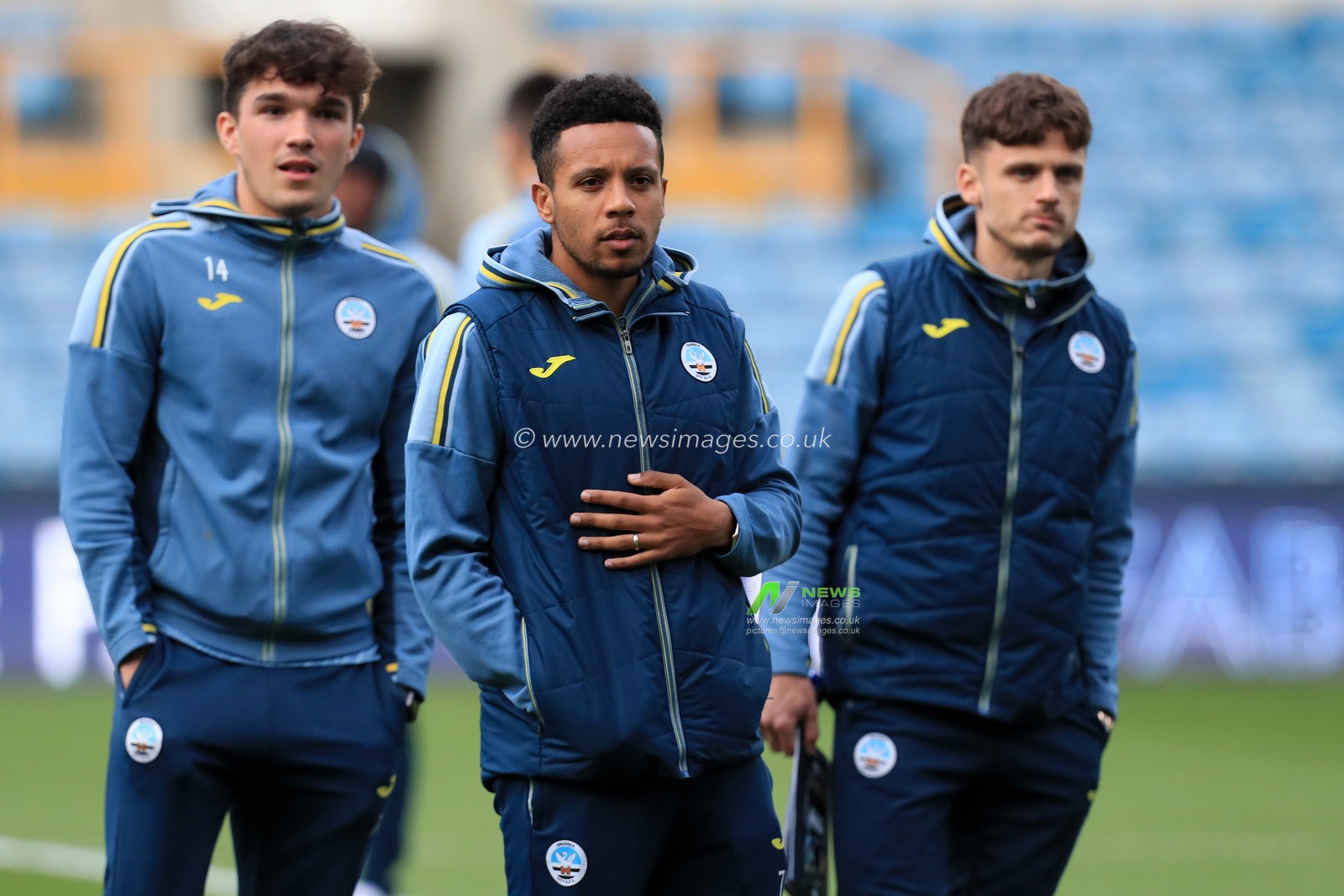 Korey Smith #7 of Swansea City and team mates prior to kick off.
