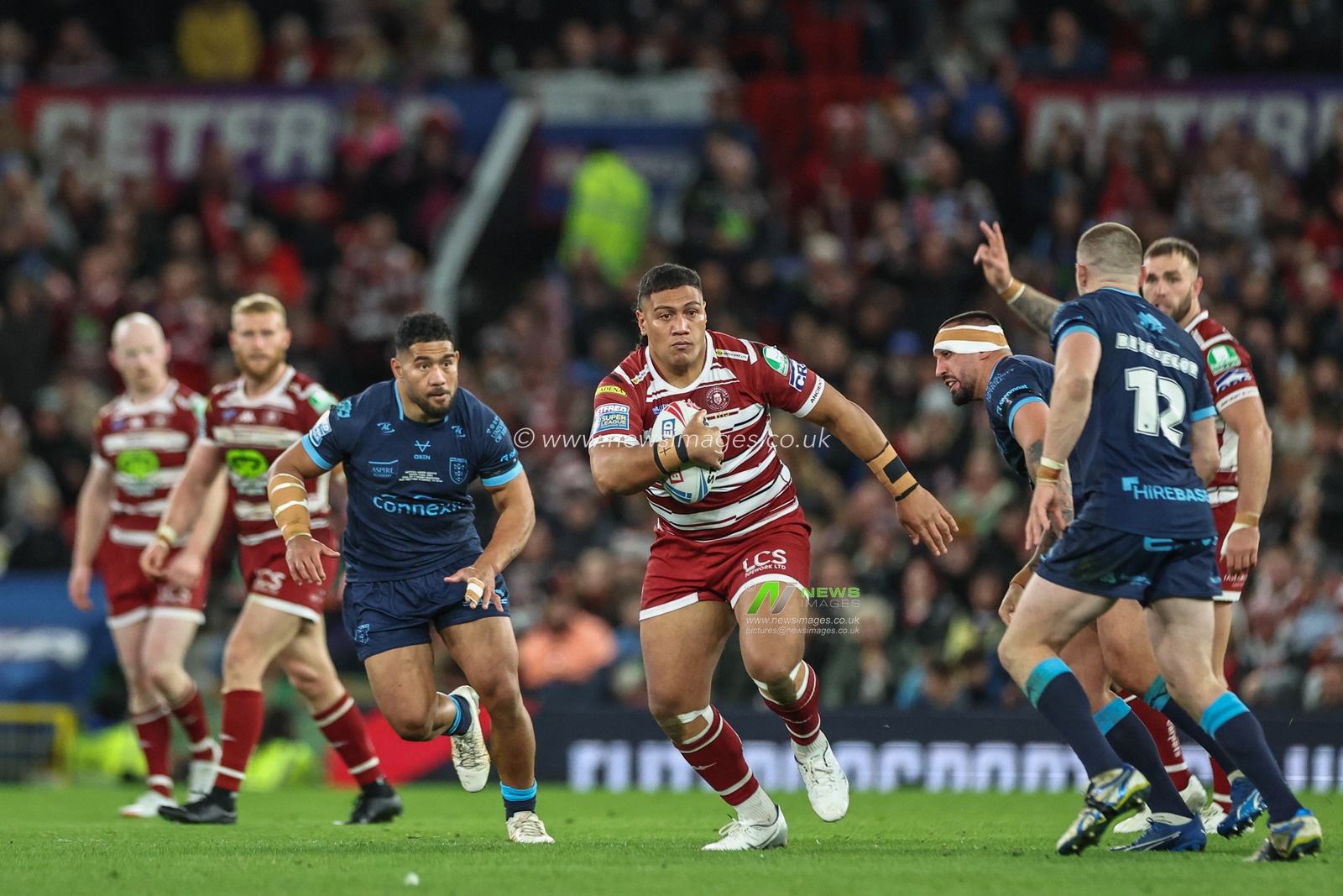 Patrick Mago of Wigan Warriors breaks with the ball during the Betfred Super League Grand Final match Wigan Warriors vs Hull KR at Old Trafford, Manchester, United Kingdom, 12th October 2024

(Photo by Mark Cosgrove/News Images)