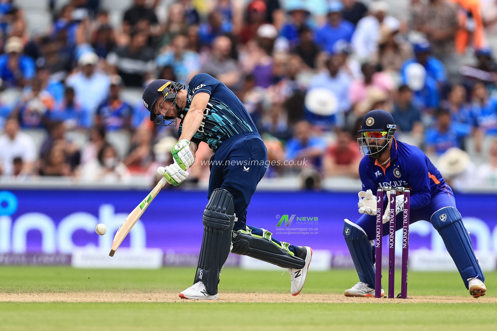 Jos Buttler of England hits a six (6)