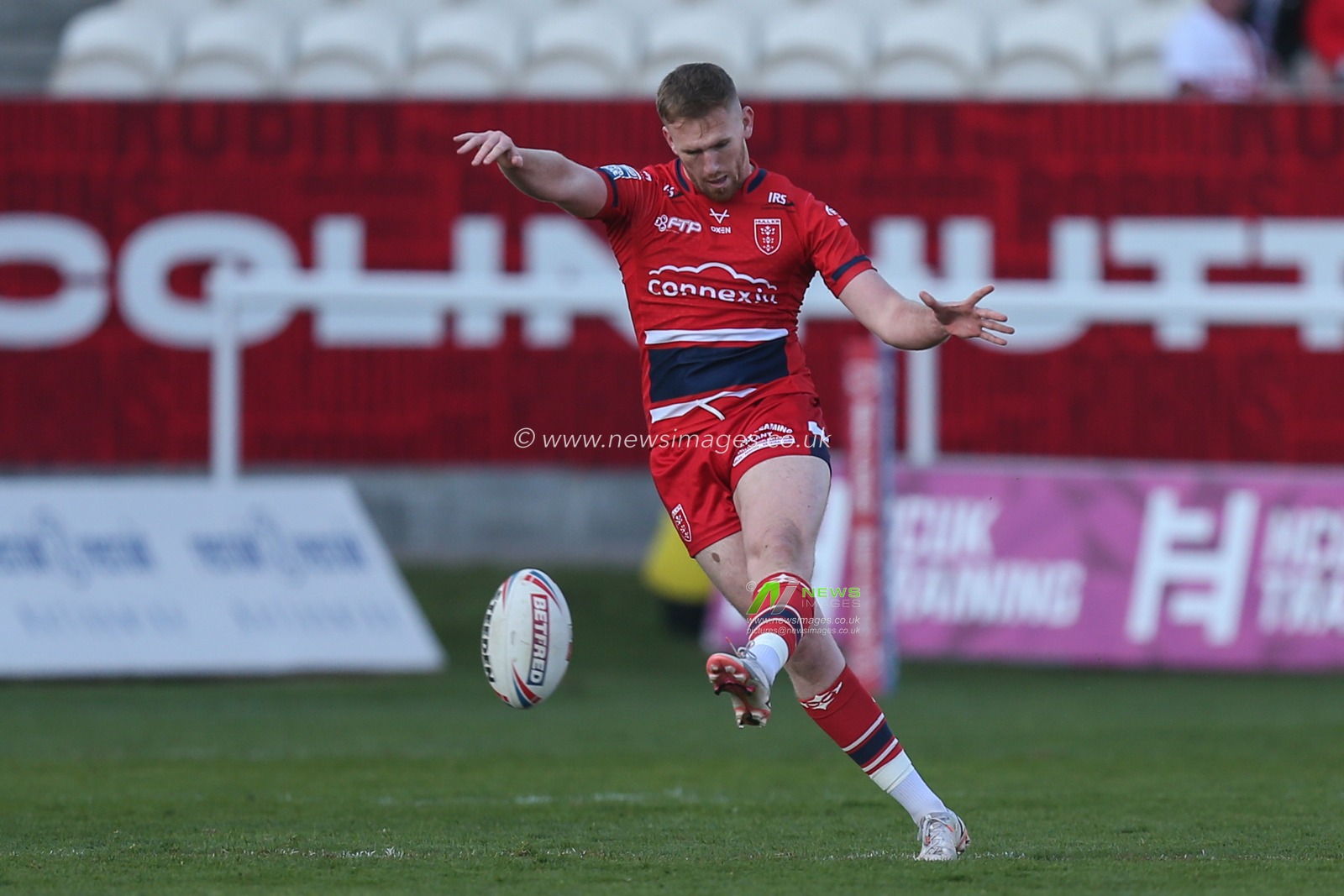 Rowan Milnes #21 of Hull KR kicks to the sideline