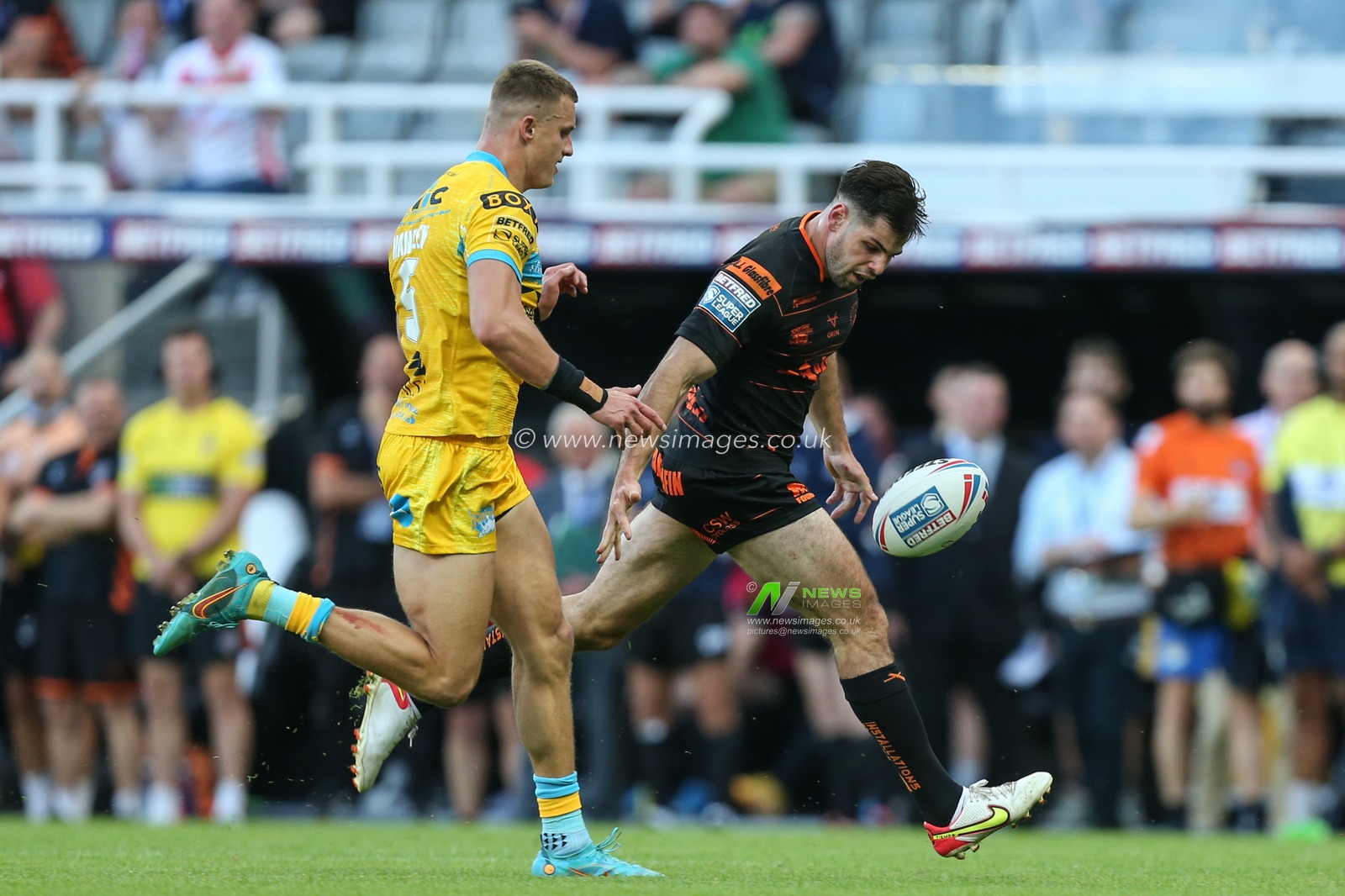 Jake Mamo #4 of Castleford Tigers gets past the Leeds defence then drops the ball