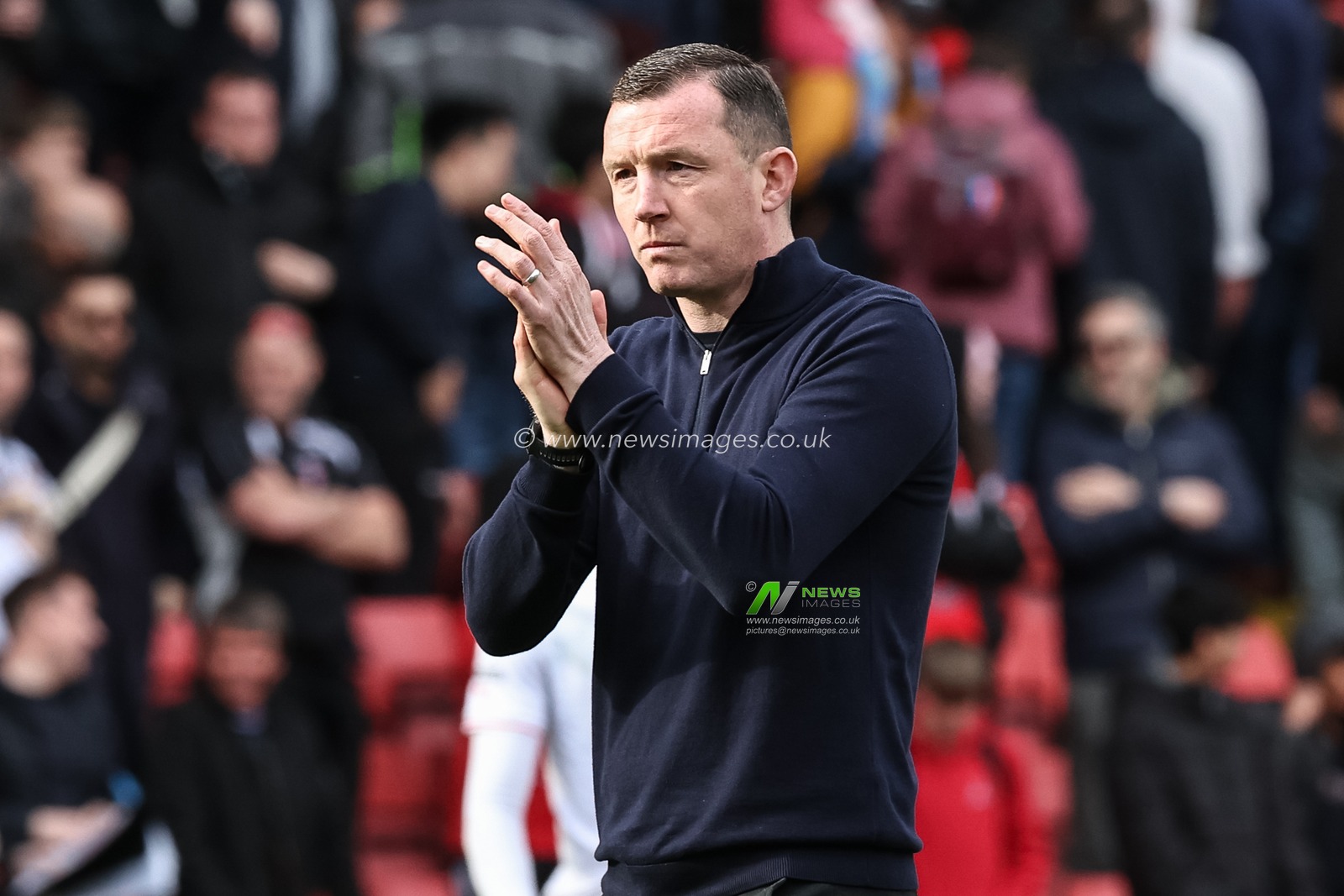 Neill Collins Head coach of Barnsley applauds the travelling fans during the Sky Bet League 1 match Charlton Athletic vs Barnsley at The Valley, London, United Kingdom, 6th April 2024

(Photo by Mark Cosgrove/News Images)
