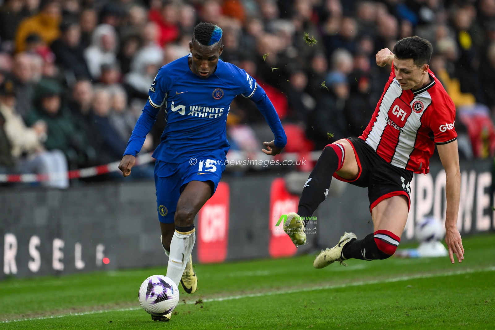 Anel AhmedhodÅ¾iÄ‡ of Sheffield United dives in to tackle Nicolas Jackson of Chelsea during the Premier League match Sheffield United vs Chelsea at Bramall Lane, Sheffield, United Kingdom, 7th April 2024

(Photo by Craig Thomas/News Images)