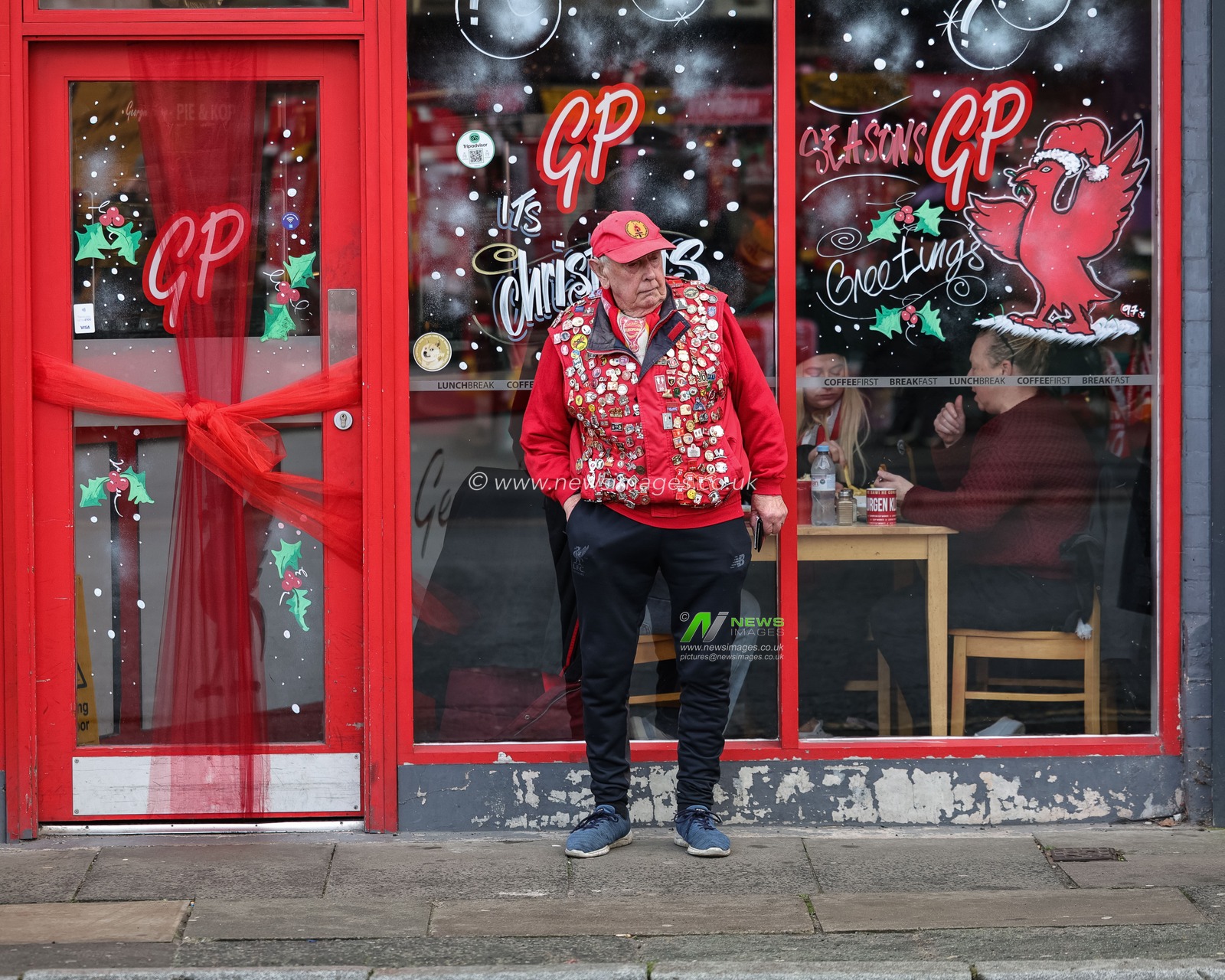 A Liverpool fan with his coat covered in pin badges during the Premier League match Liverpool vs Wolverhampton Wanderers at Anfield, Liverpool, United Kingdom, 27th December 2025

(Photo by Mark Cosgrove/News Images)

*** GER AUT SUI OUT ***