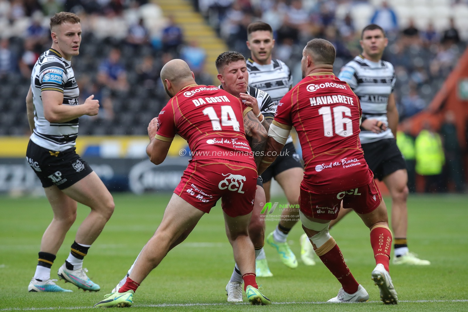 Joe Cator #15 of Hull FC is tackled by Alrix Da Costa #14 of Catalans Dragons and Romain Navarette #16 of Catalans Dragons during the Betfred Super League Round 17 Hull FC vs Catalans Dragons at MKM Stadium, Hull, United Kingdom, 1st July 2023

(Photo by James Heaton/News Images)