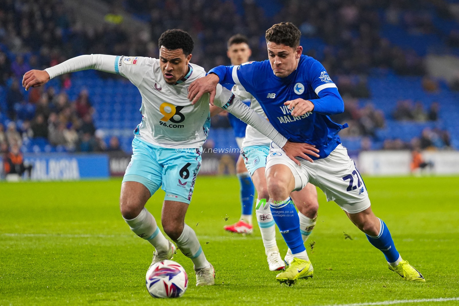 CJ Egan-Riley of Burnley under pressure from Yousef Salech of Cardiff City during the Sky Bet Championship match Cardiff City vs Burnley at Cardiff City Stadium, Cardiff, United Kingdom, 4th March 2025

(Photo by Andrew Lewis/News Images)