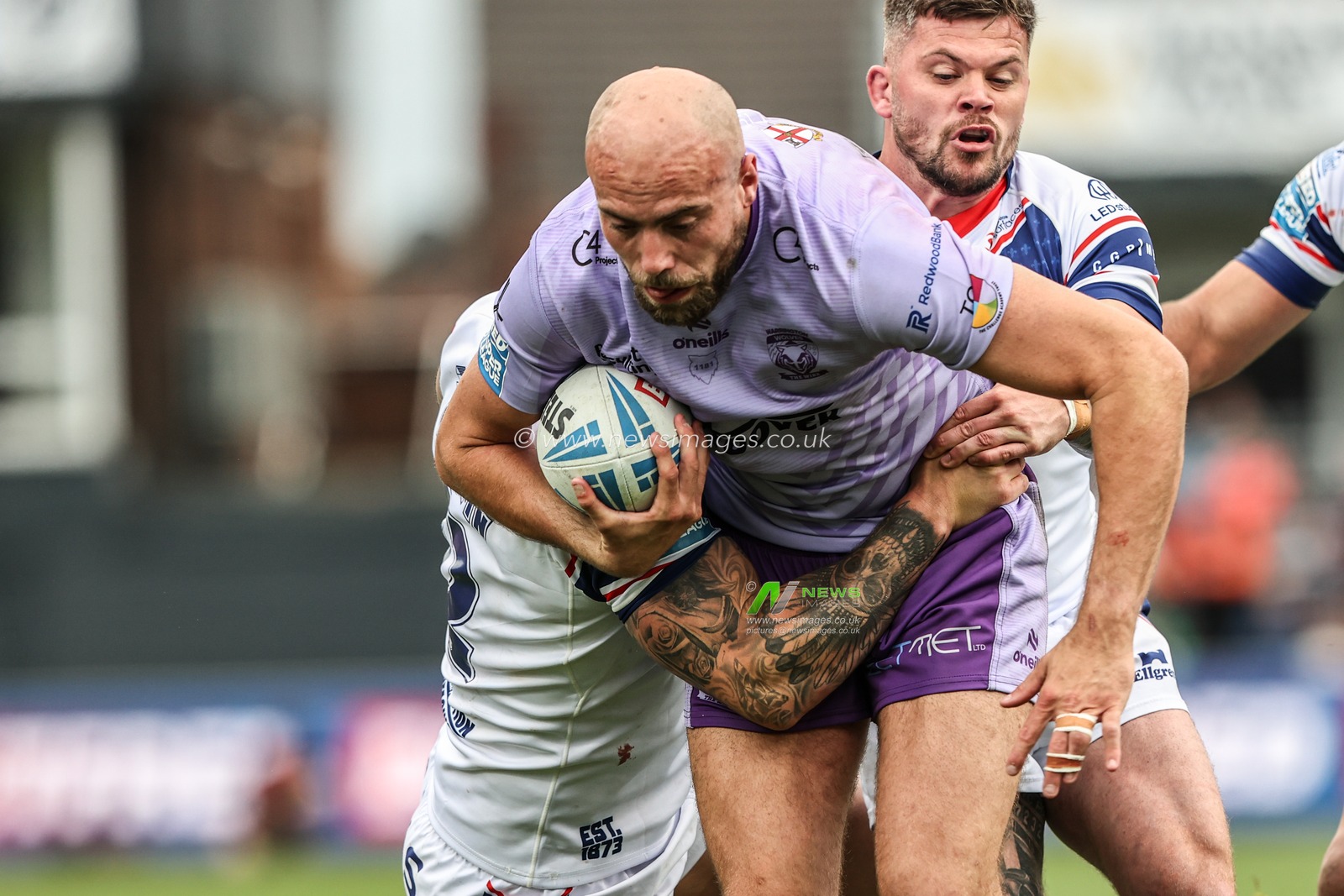 James Harrison of Warrington Wolves is tackled during the Betfred Super League Round 11 match Wakefield Trinity vs Warrington Wolves at DIY Kitchens Stadium, Wakefield, United Kingdom, 18th May 2025

(Photo by Alfie Cosgrove/News Images)