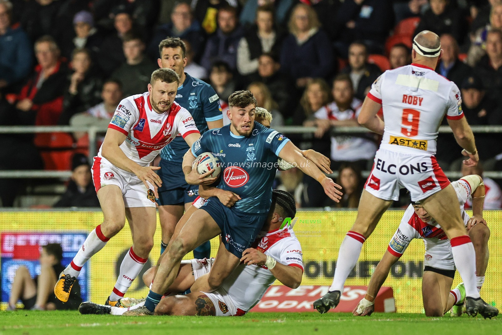 Matty Ashton #5 of Warrington Wolves is tackled by Mark Percival #4 of St Helens during the Betfred Super League Round 10 match St Helens vs Warrington Wolves at Totally Wicked Stadium, St Helens, United Kingdom, 20th April 2023

(Photo by Mark Cosgrove/News Images)