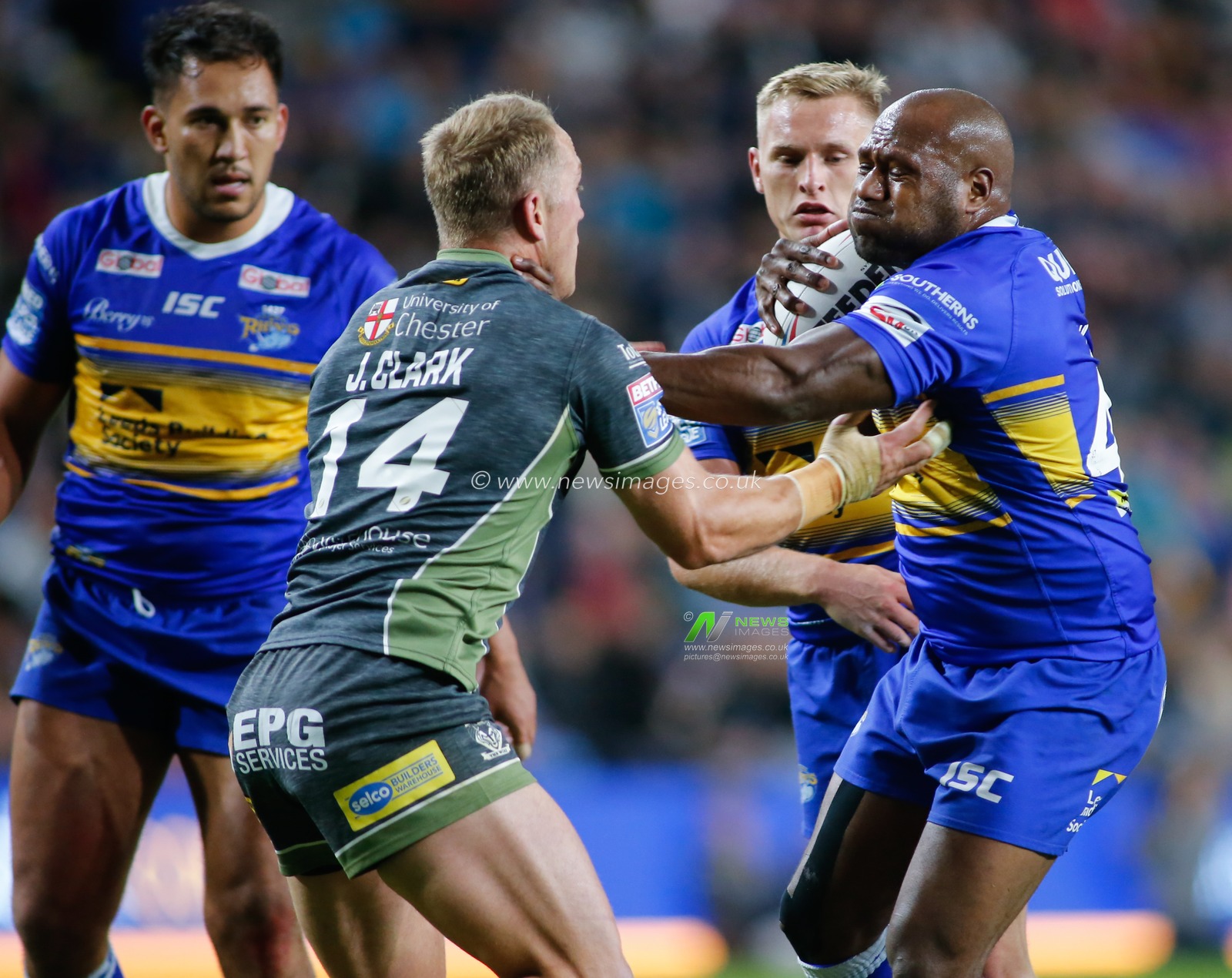 13th September 2019 , Emerald Headingley Stadium, England; Betfred Super League Rugby , Round 29, Leeds Rhinos vs Warrington Wolves ;  Robert Lui (40)(R) of Leeds Rhinos hands of Jason Clark (14) of Warrington Wolves.

Credit: Steve Gaunt/News Images