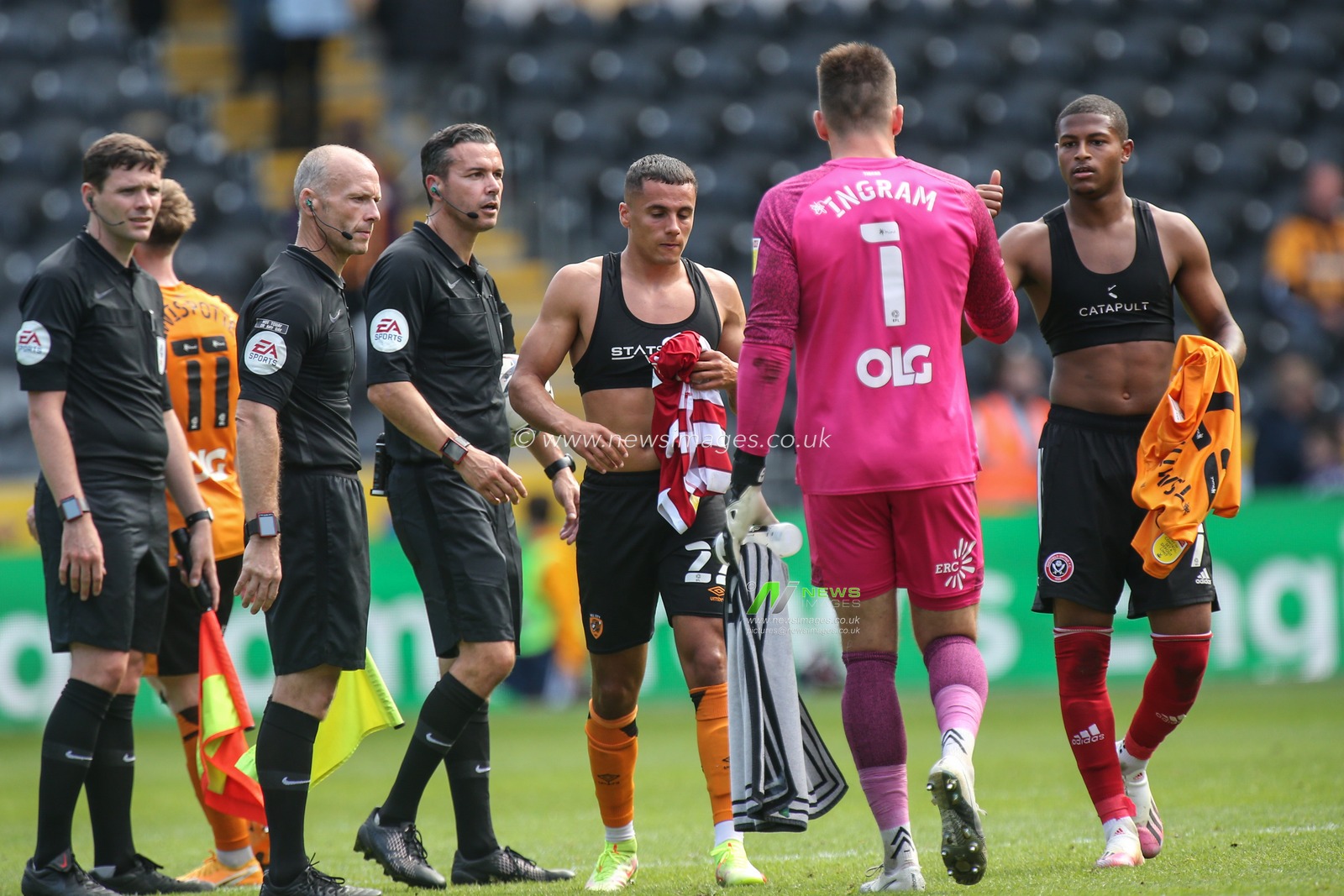 Tyler Smith #22 of Hull City swaps shirts at the end of the match
