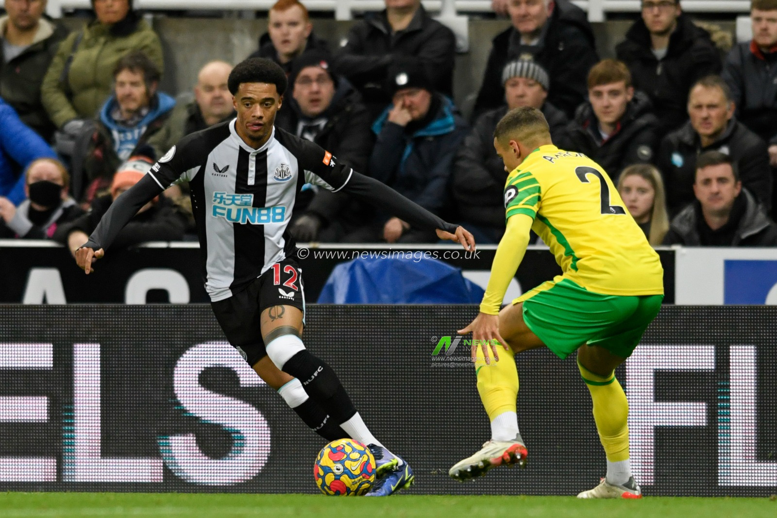 Jamal Lewis #12 of Newcastle United looks for a way past Max Aarons #2 of Norwich City