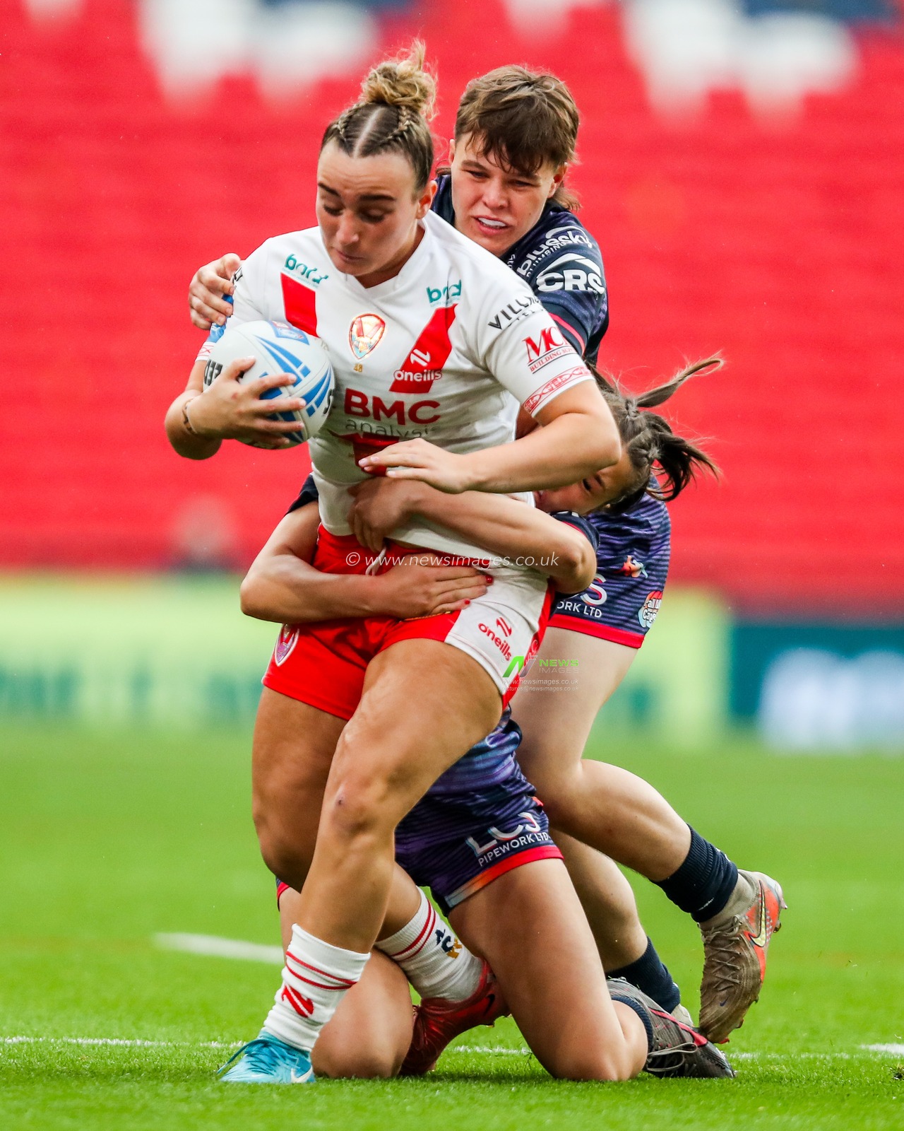 Molly Jones of Wigan Warriors makes a tackle during the Betfred Women's Challenge Cup Final St Helens vs Wigan Warriors at Wembley Stadium, London, United Kingdom, 7th June 2025

(Photo by Izzy Poles/News Images)