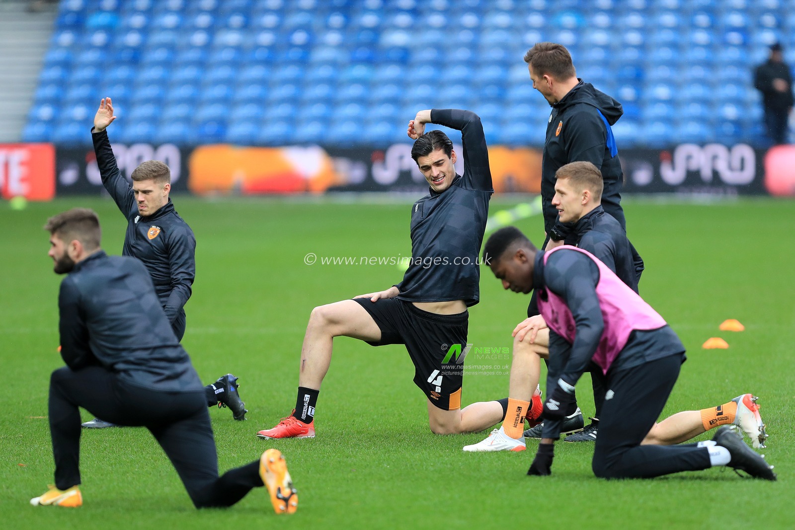 Jacob Greaves #4 of Hull City stretches during the warm up