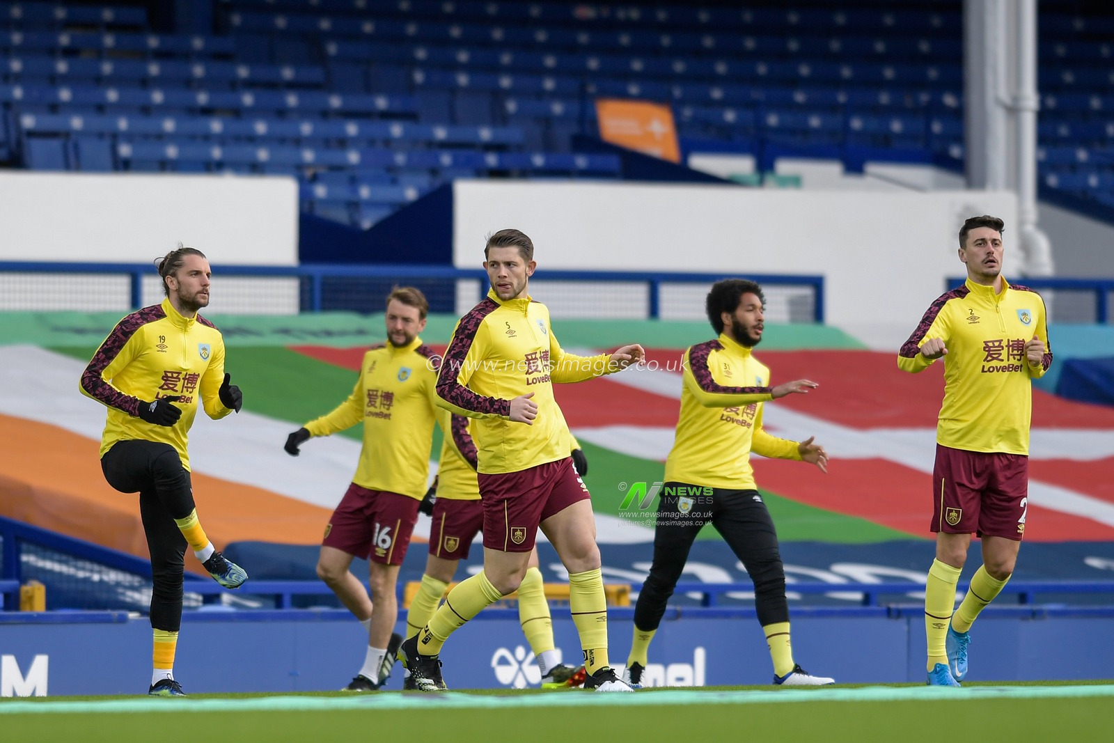 The Burnley players begin their warm up