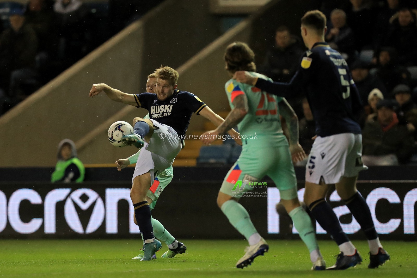 Billy Mitchell #24 of Millwall clears under pressure.