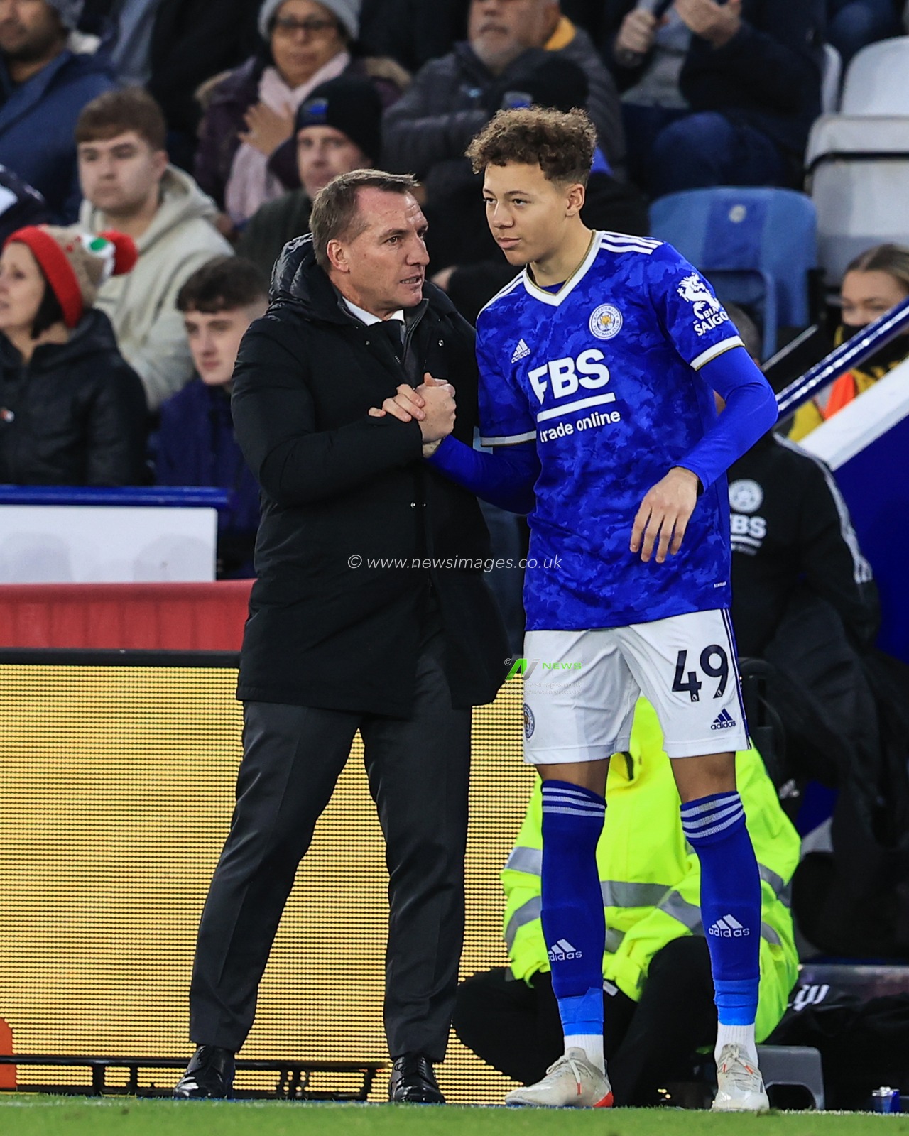 Brendan Rogers manager of Leicester City shakes hands with Casey Mcateer #49 of Leicester City as he prepares to enter the field of play