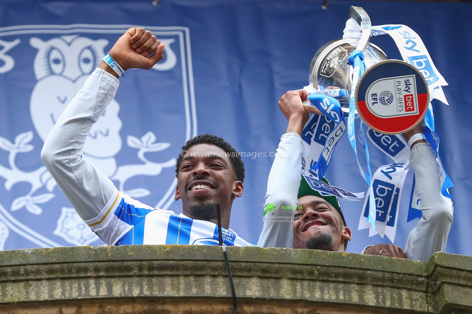 Tyreeq Bakinson #19 of Sheffield Wednesday and Jaden Brown #3 of Sheffield Wednesday interacts with the fans as Sheffield Wednesday celebrate promotion in the City at Sheffield City Centre, Sheffield, United Kingdom, 31st May 2023

(Photo by Gareth Evans/News Images)