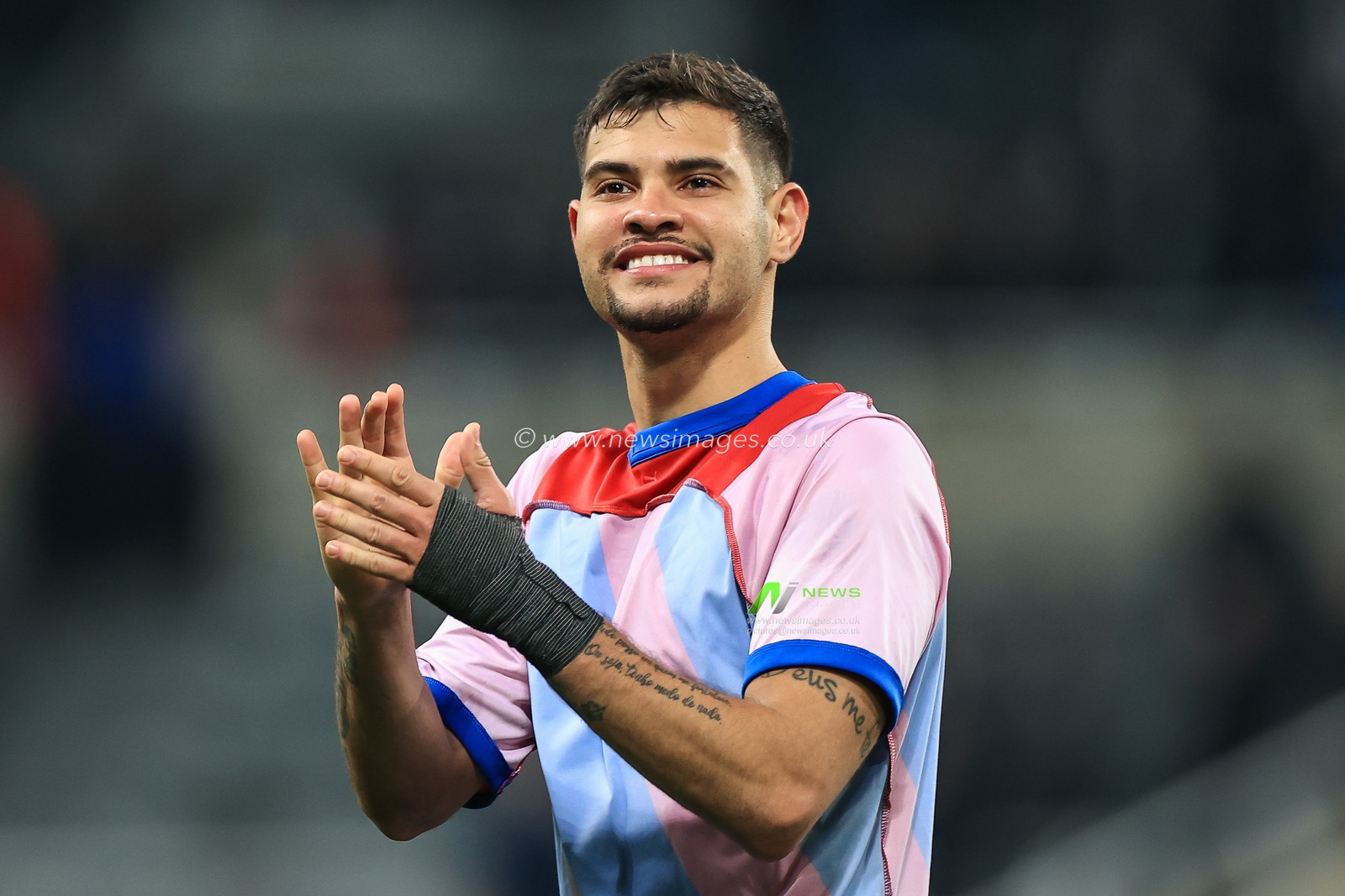 Bruno Guimaraes #39 of Newcastle United applauds the fans at the end of the game