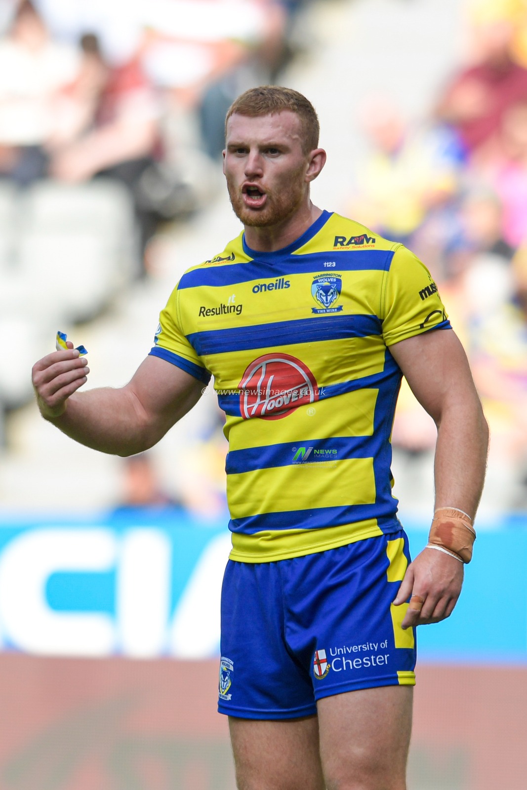 Jack Hughes (12) of Warrington Wolves gives instructions during the game