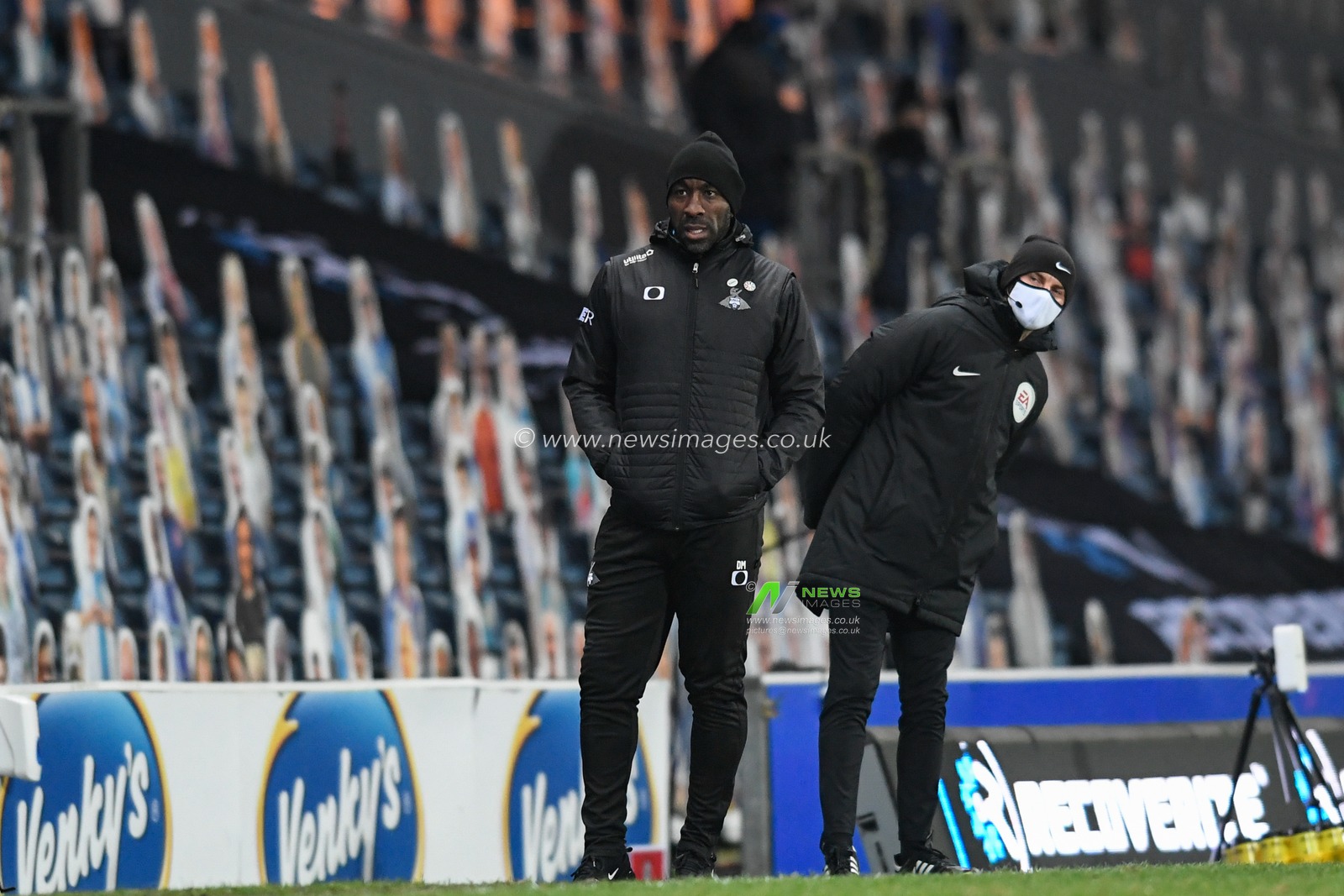Darren Moore manager of Doncaster Rovers watches from the technical area