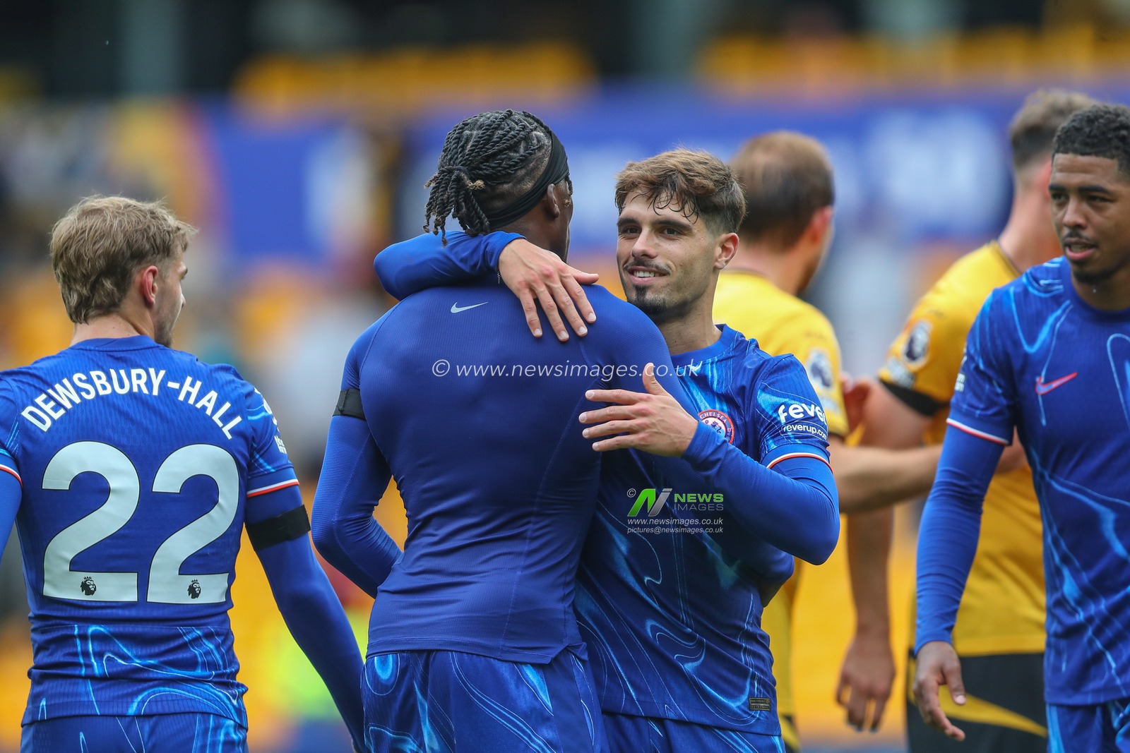 Noni Madueke of Chelsea embraces Pedro Neto of Chelsea after the game during the Premier League match Wolverhampton Wanderers vs Chelsea at Molineux, Wolverhampton, United Kingdom, 25th August 2024

(Photo by Gareth Evans/News Images)