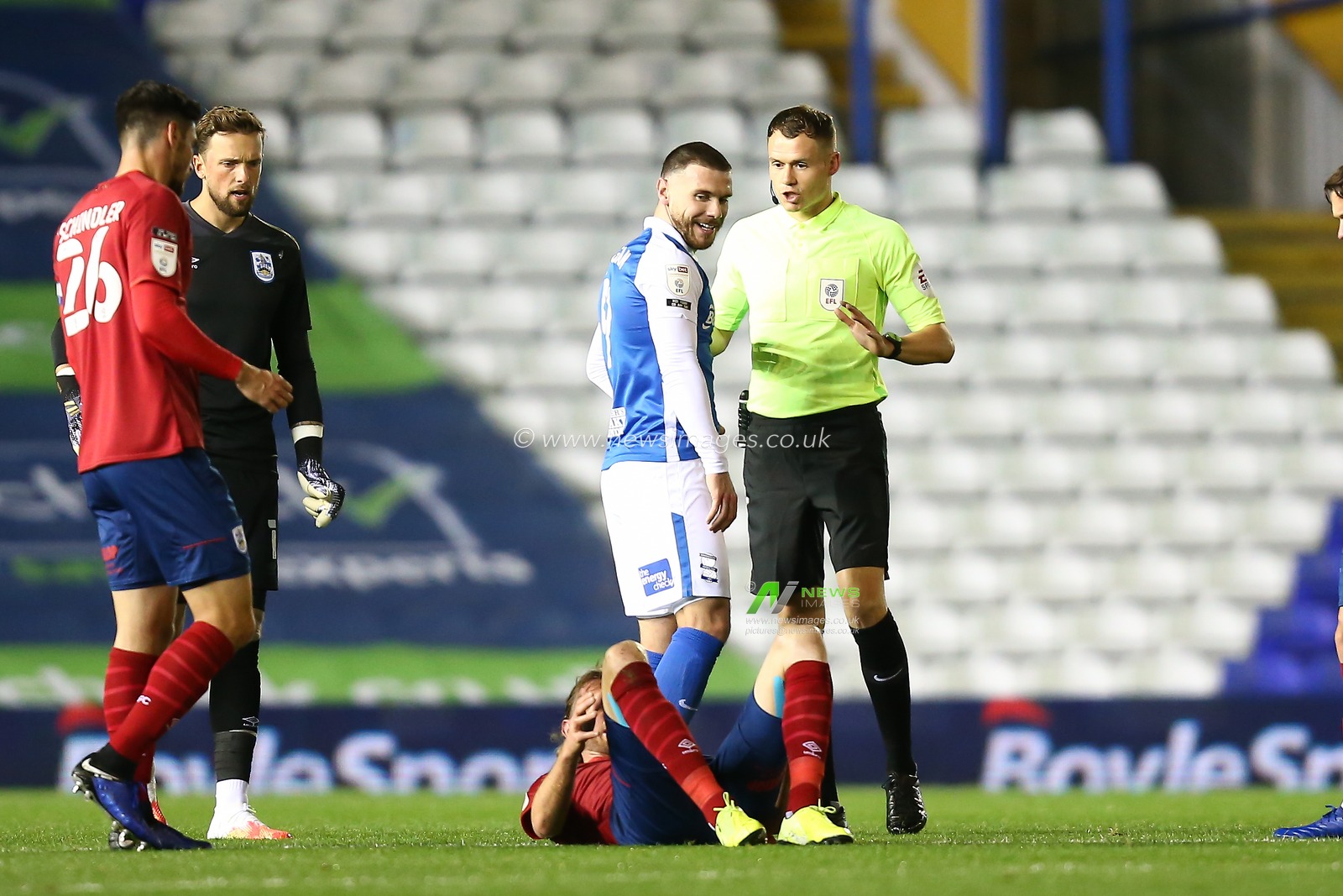 Scott Hogan (9) of Birmingham City finds the funny side of his booking
