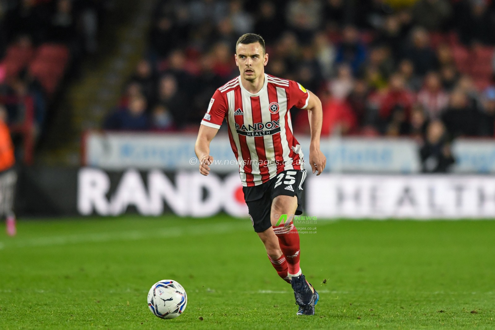 Filip Uremovic #25 of Sheffield United runs forward with the ball