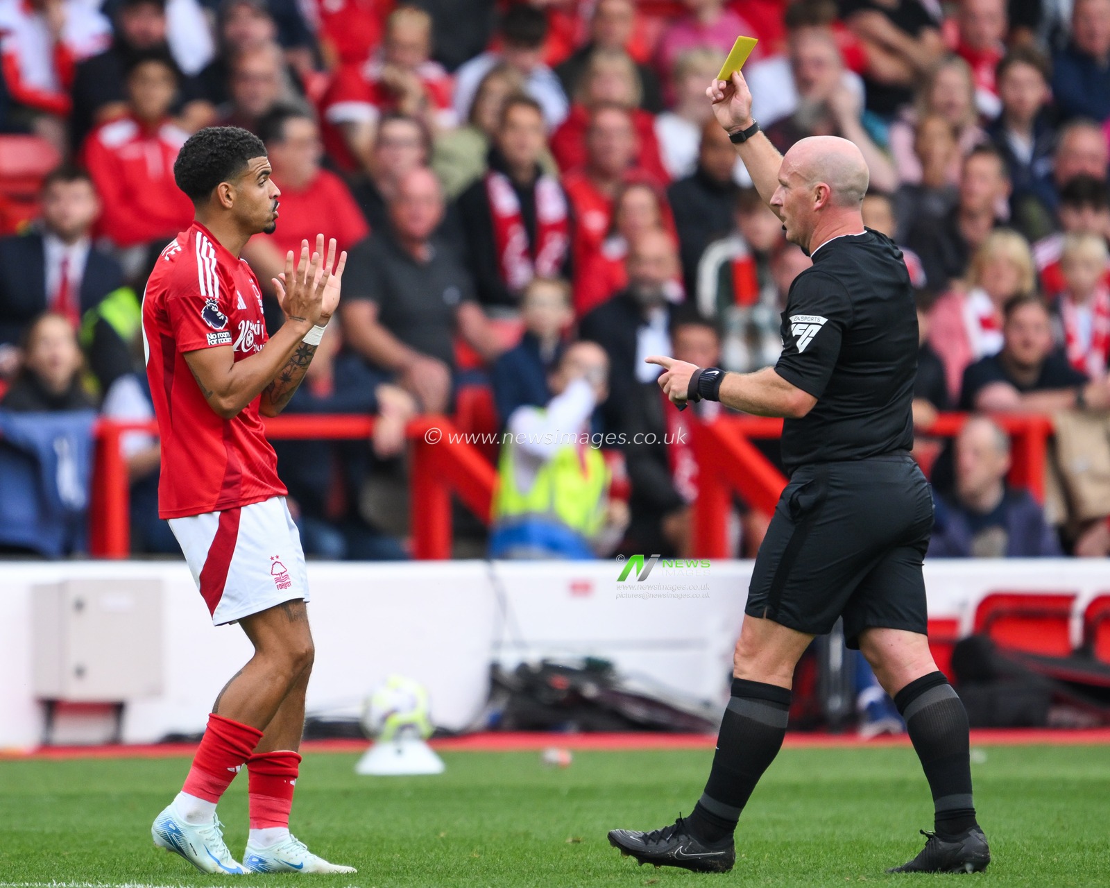 Referee Simon Hooper gives a yellow card to Morgan Gibbs-White of Nottingham Forest during the Premier League match Nottingham Forest vs Wolverhampton Wanderers at City Ground, Nottingham, United Kingdom, 31st August 2024

(Photo by Craig Thomas/News Images)