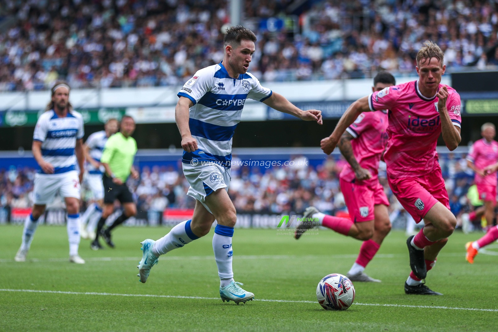 Paul Smyth of Queens Park Rangers battles for the ball with Torbjoan Heggem of West Bromwich Albion during the Sky Bet Championship match Queens Park Rangers vs West Bromwich Albion at Kiyan Prince Foundation Stadium, London, United Kingdom, 10th August 2024

(Photo by Izzy Poles/News Images)