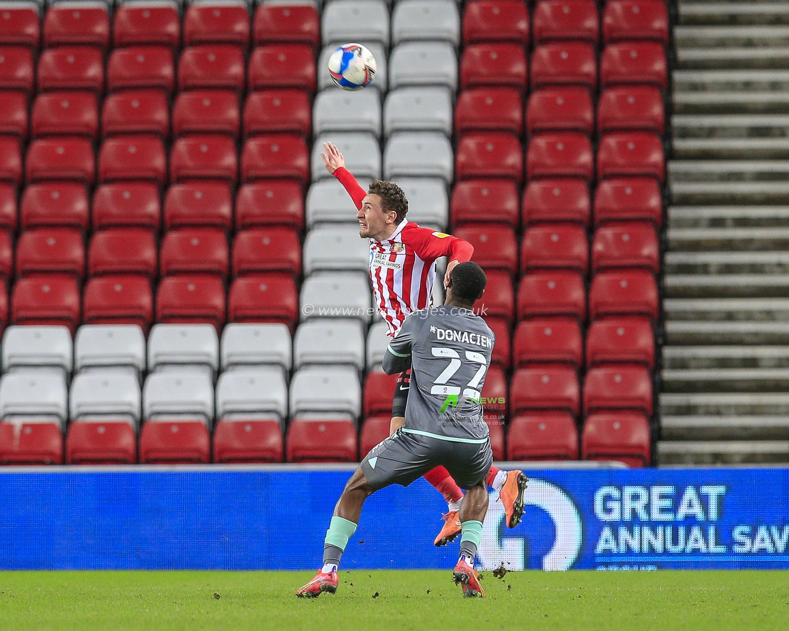 Callum McFadzean #25 of Sunderland in an aerial challenge with Janoi Donacien #22 of Fleetwood Town