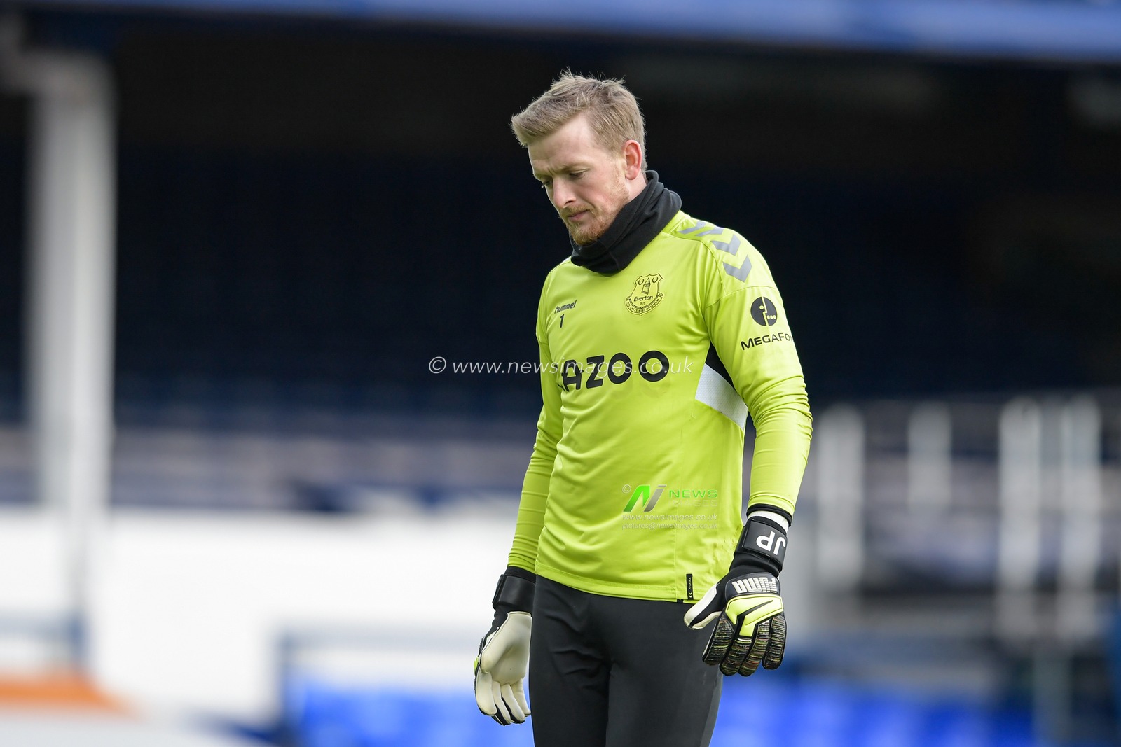 Jordan Pickford #1 of Everton looks down at the ground